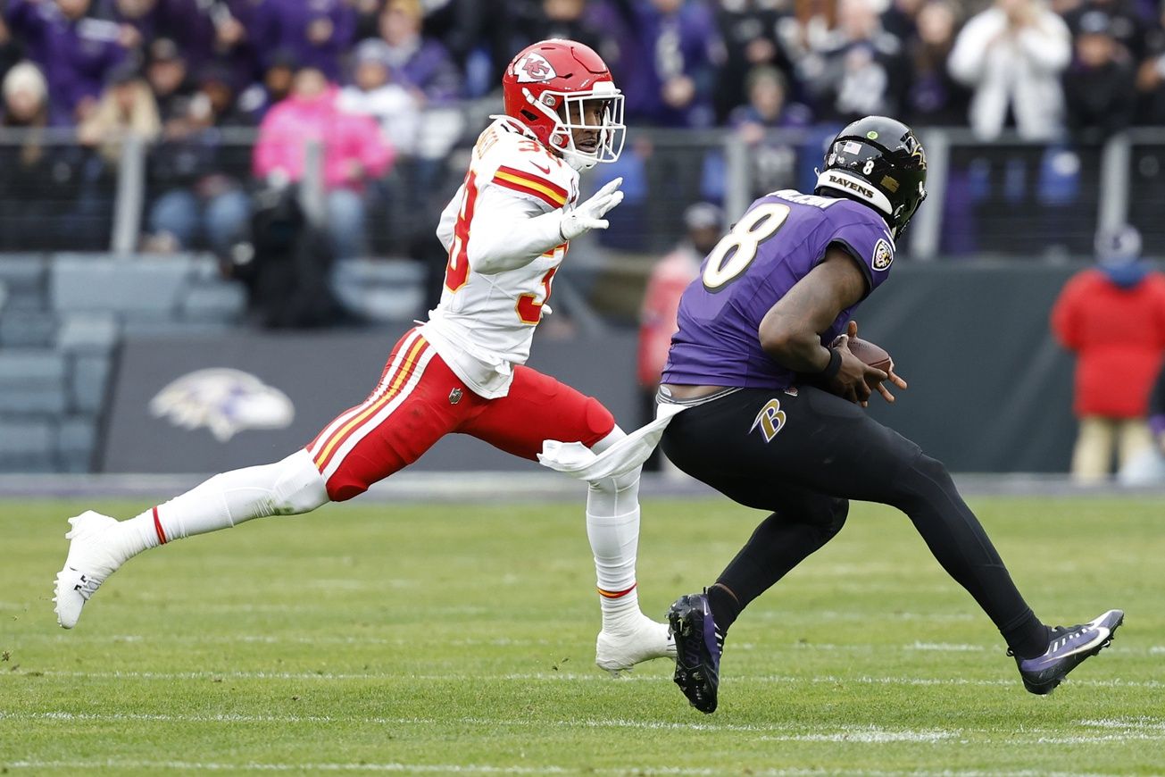 Kansas City Chiefs cornerback L'Jarius Sneed (38) chases Baltimore Ravens quarterback Lamar Jackson (8) in the AFC Championship football game at M&T Bank Stadium.