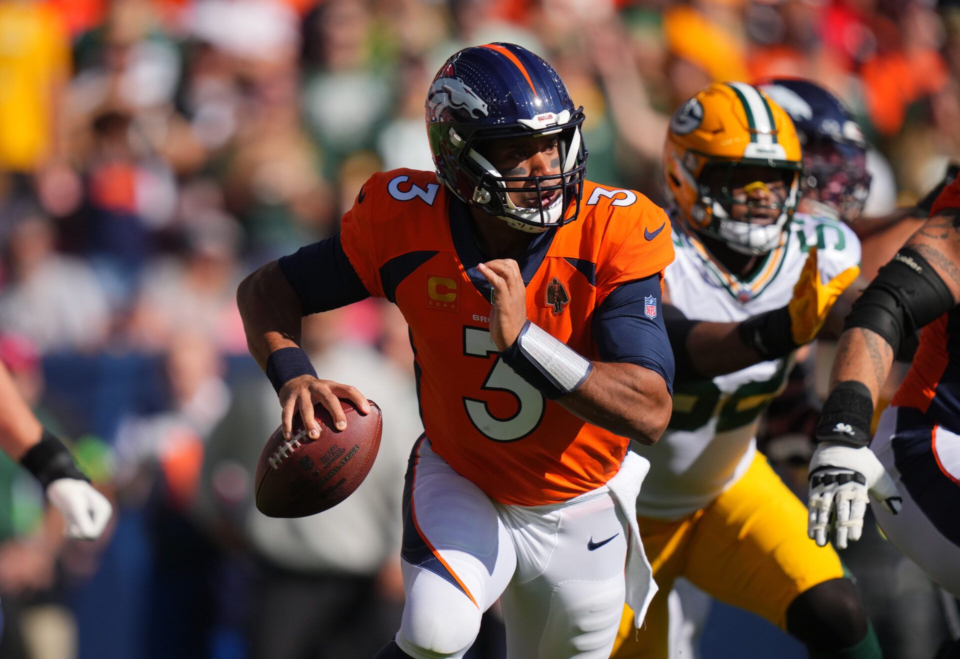 Denver Broncos quarterback Russell Wilson (3) during the first quarter against the Green Bay Packers at Empower Field at Mile High.