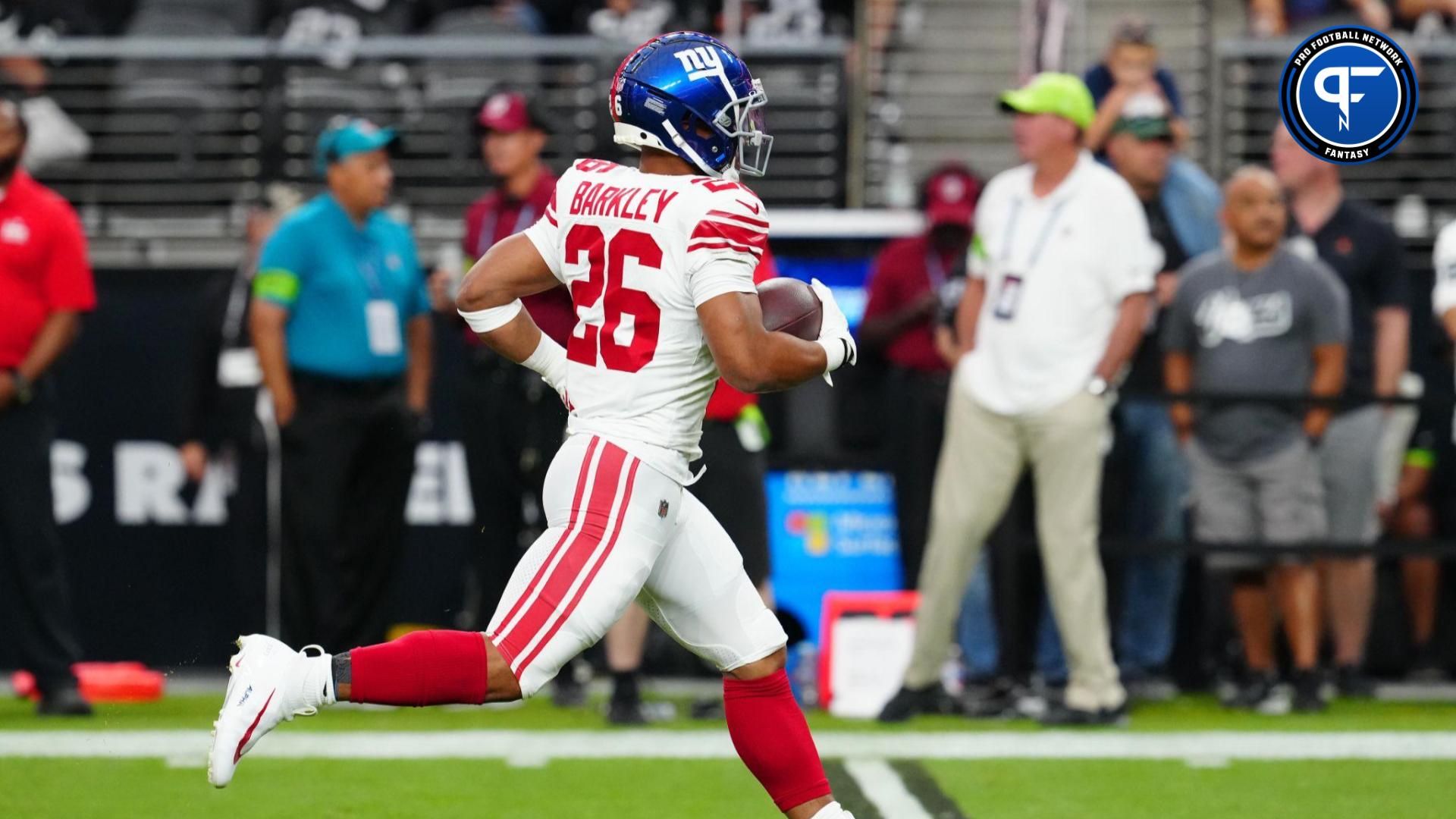 New York Giants running back Saquon Barkley (26) warms up before a game against the Las Vegas Raiders at Allegiant Stadium.