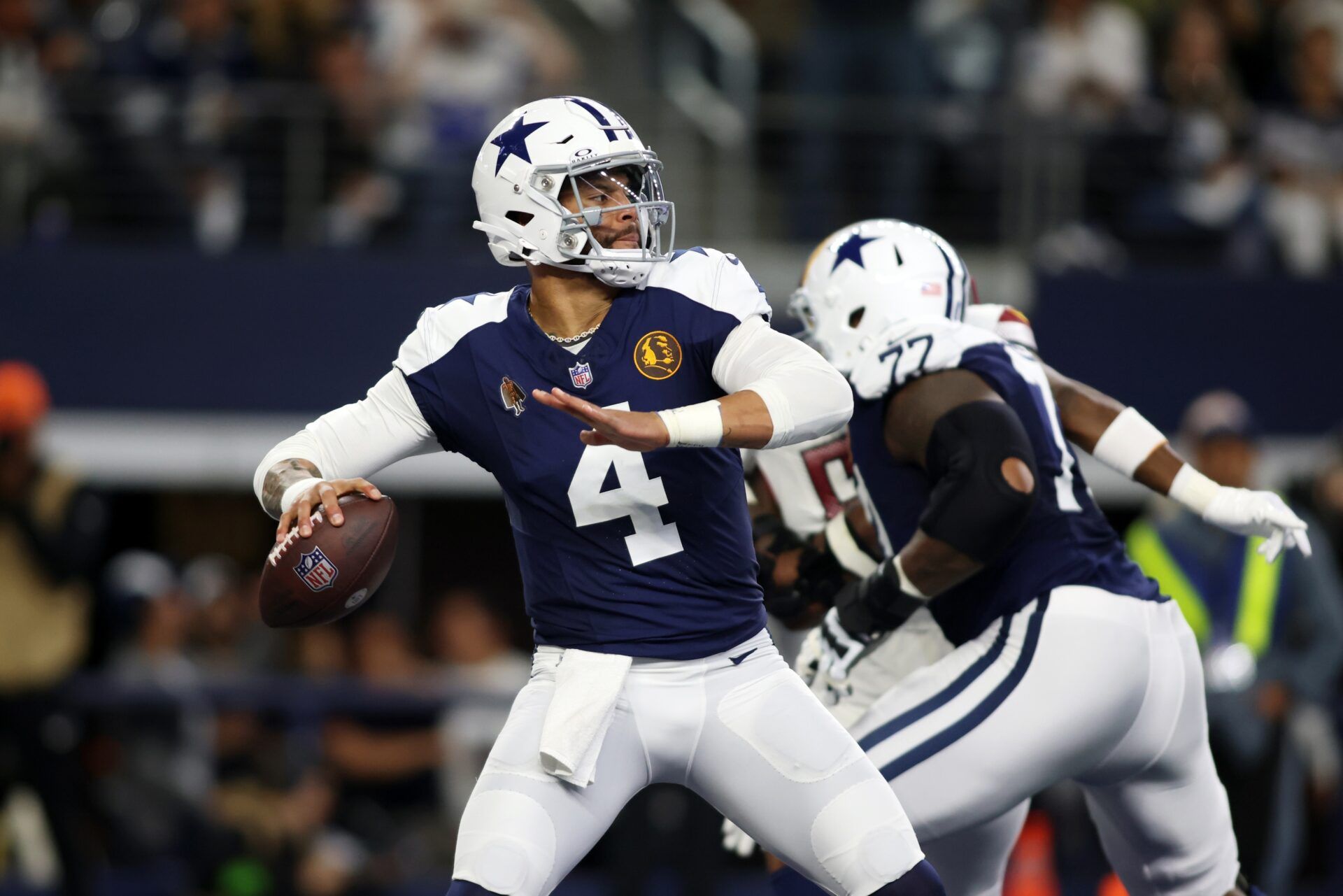 Dallas Cowboys quarterback Dak Prescott (4) throws a pass in the first quarter against the Washington Commanders at AT&T Stadium.