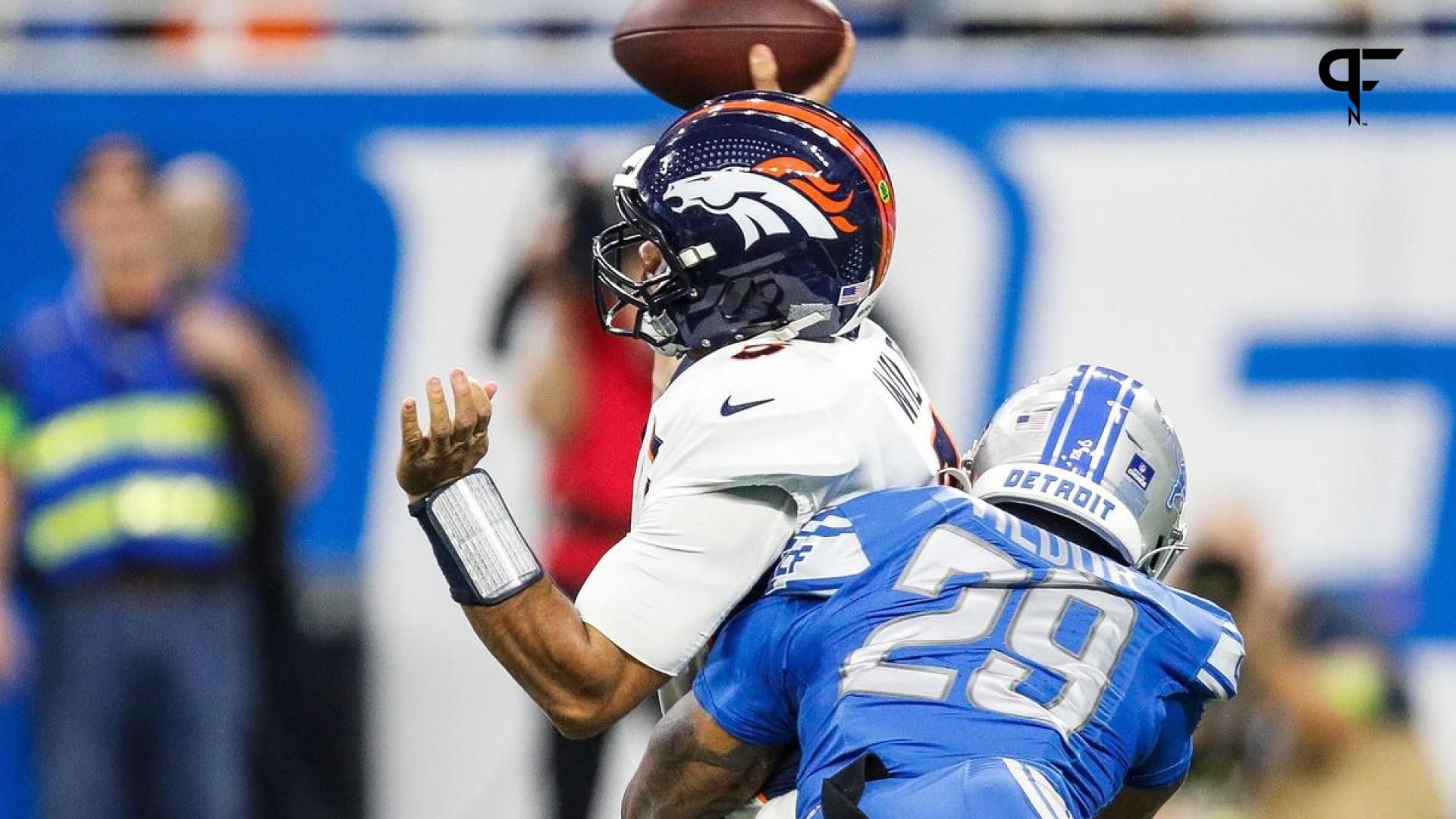 Detroit Lions CB Kindle Vildor (29) tackles Denver Broncos QB Russell Wilson (3).