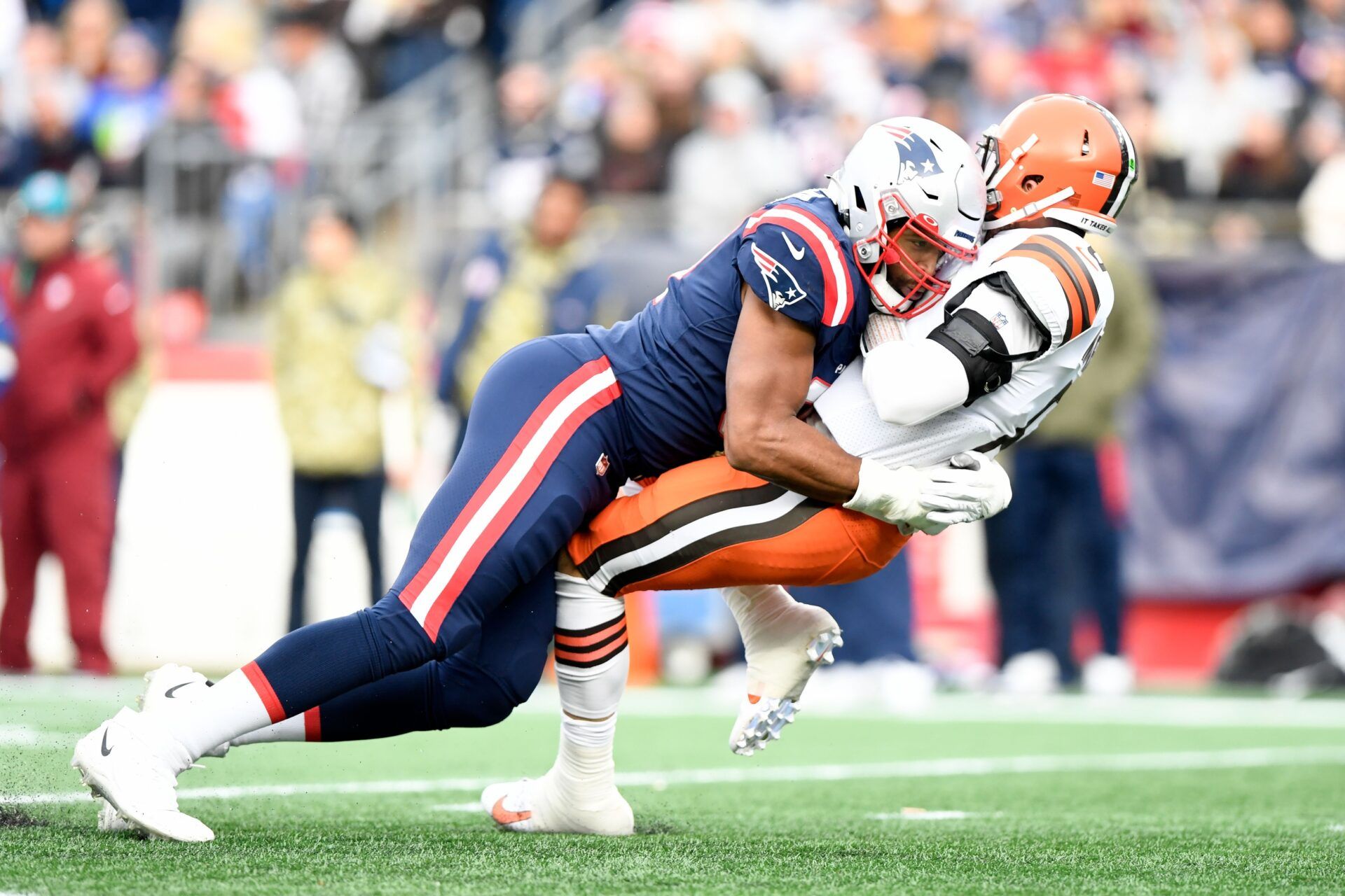 New England Patriots defensive end Deatrich Wise (91) draws a penalty for a late hit on Cleveland Browns quarterback Baker Mayfield (6) during the second half at Gillette Stadium.