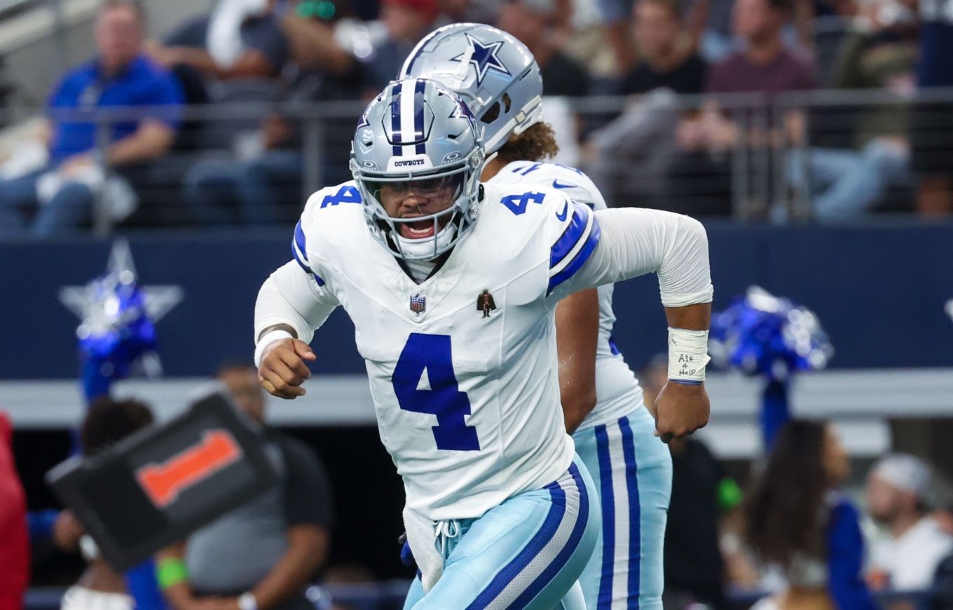 Dallas Cowboys quarterback Dak Prescott (4) celebrates after throwing a touchdown pass.