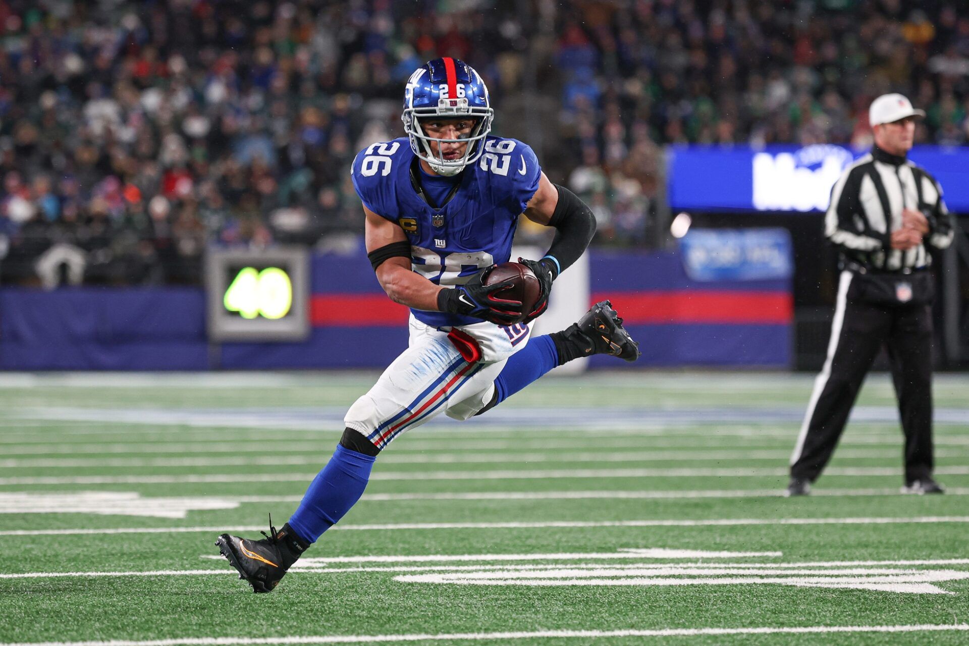 New York Giants RB Saquon Barkley (26) scores a touchdown against the Philadelphia Eagles.