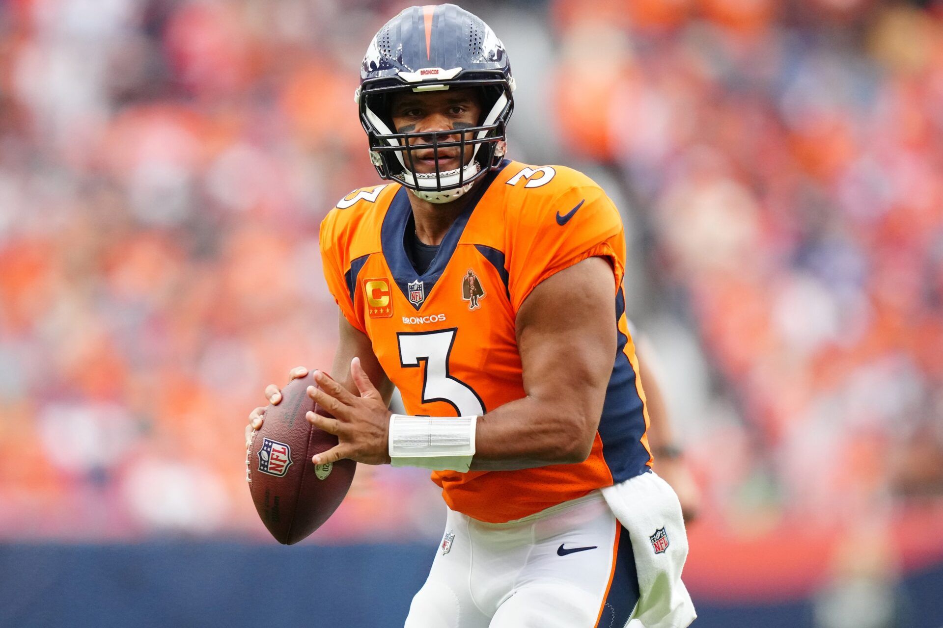 Sep 10, 2023; Denver, Colorado, USA; Denver Broncos quarterback Russell Wilson (3) prepares to pass to wide receiver Courtland Sutton (14) (not pictured) who scored a touchdown in the second quarter against the Las Vegas Raiders at Empower Field at Mile High. Mandatory Credit: Ron Chenoy-USA TODAY Sports