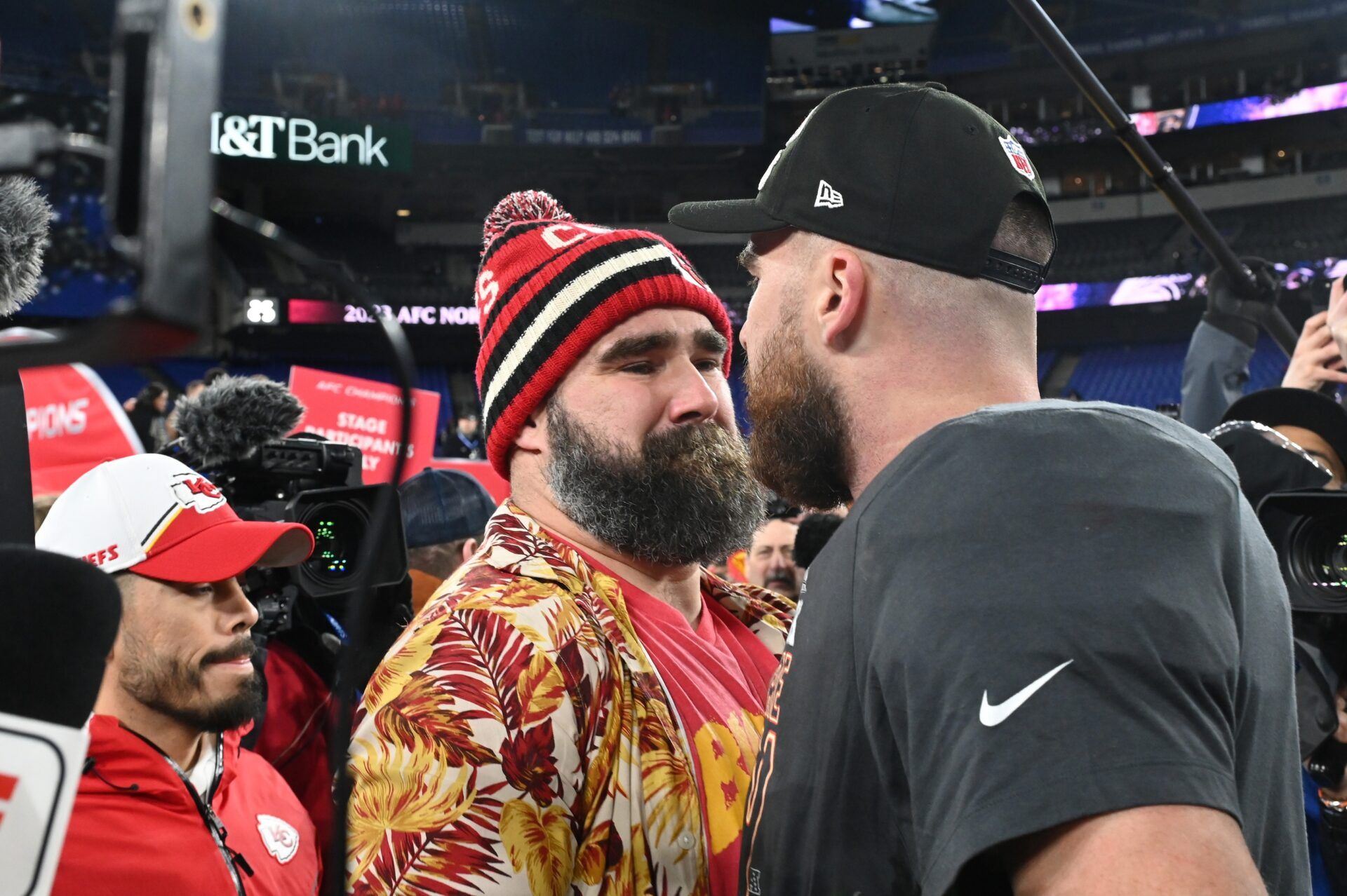 Kansas City Chiefs tight end Travis Kelce (87) celebrates with Jason Kelce (center) after the Kansas City Chiefs won the AFC Championship.