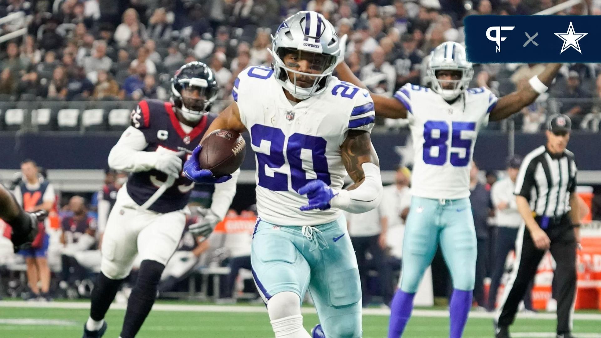 Dallas Cowboys running back Tony Pollard (20) carries the ball on a 11-yard touchdown run against the Houston Texans during the first half at AT&T Stadium.