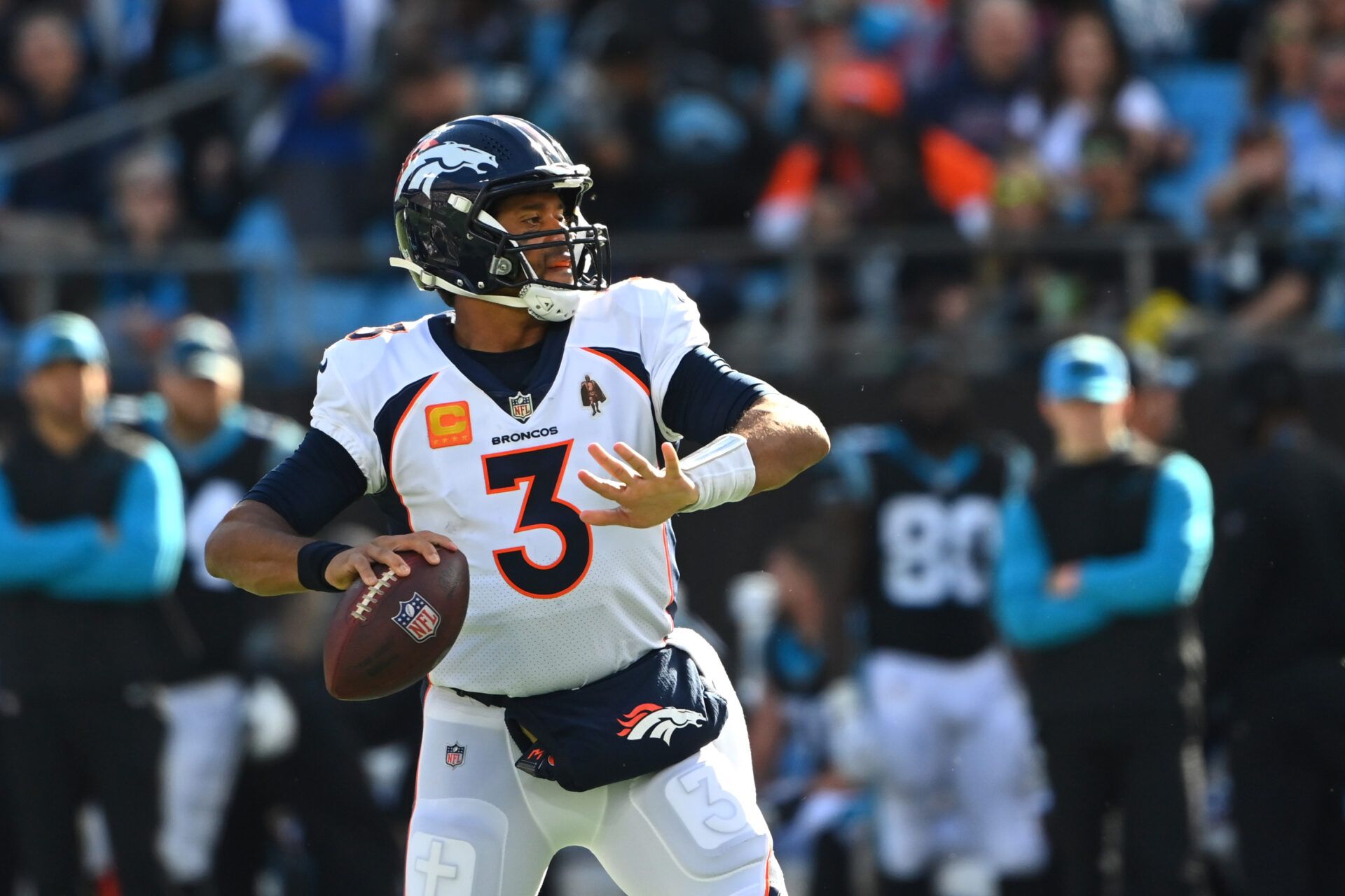 Denver Broncos quarterback Russell Wilson (3) looks to pass in the second quarter at Bank of America Stadium.