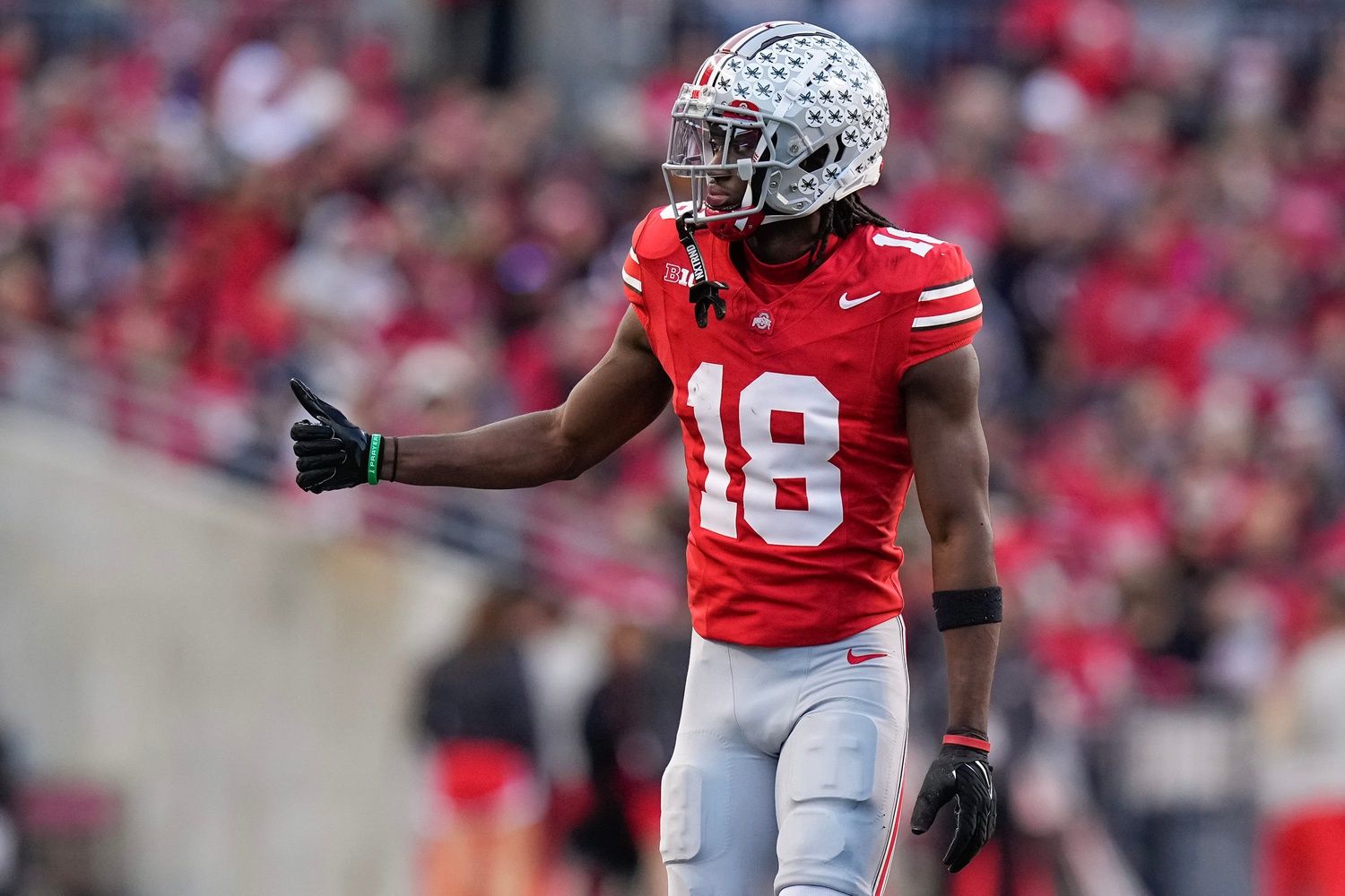 Ohio State Buckeyes wide receiver Marvin Harrison Jr. (18) checks in as an eligible receiver during the NCAA football game against the Minnesota Golden Gophers at Ohio Stadium.