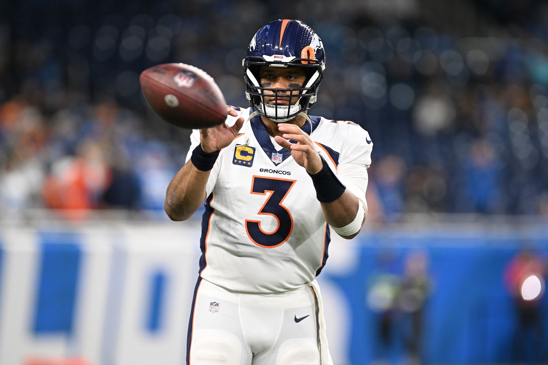 Denver Broncos QB Russell Wilson (3) warms up prior to a game against the Detroit Lions.