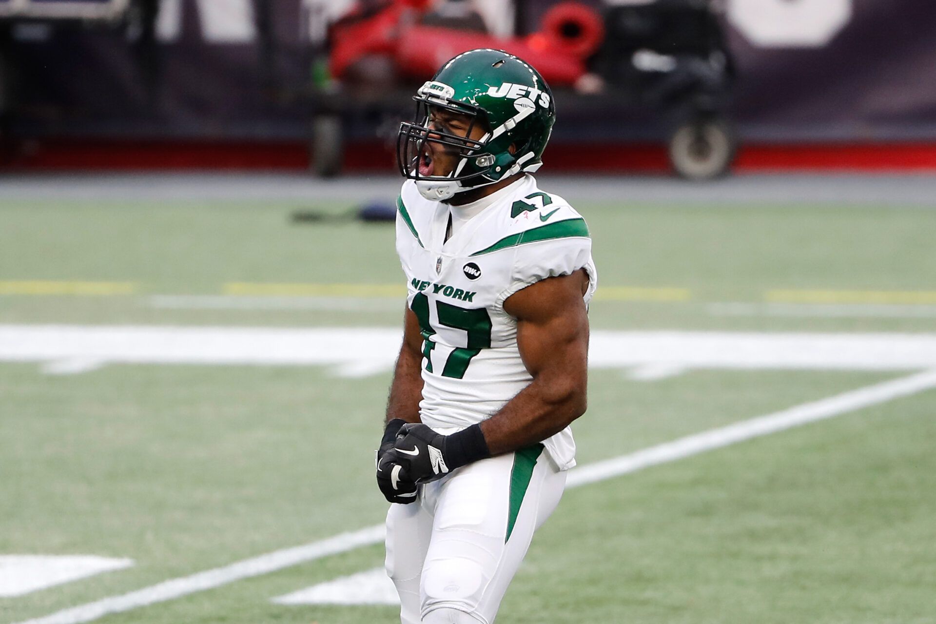 New York Jets defensive end Bryce Huff (47) celebrates a sack against the New England Patriots during the first half at Gillette Stadium.