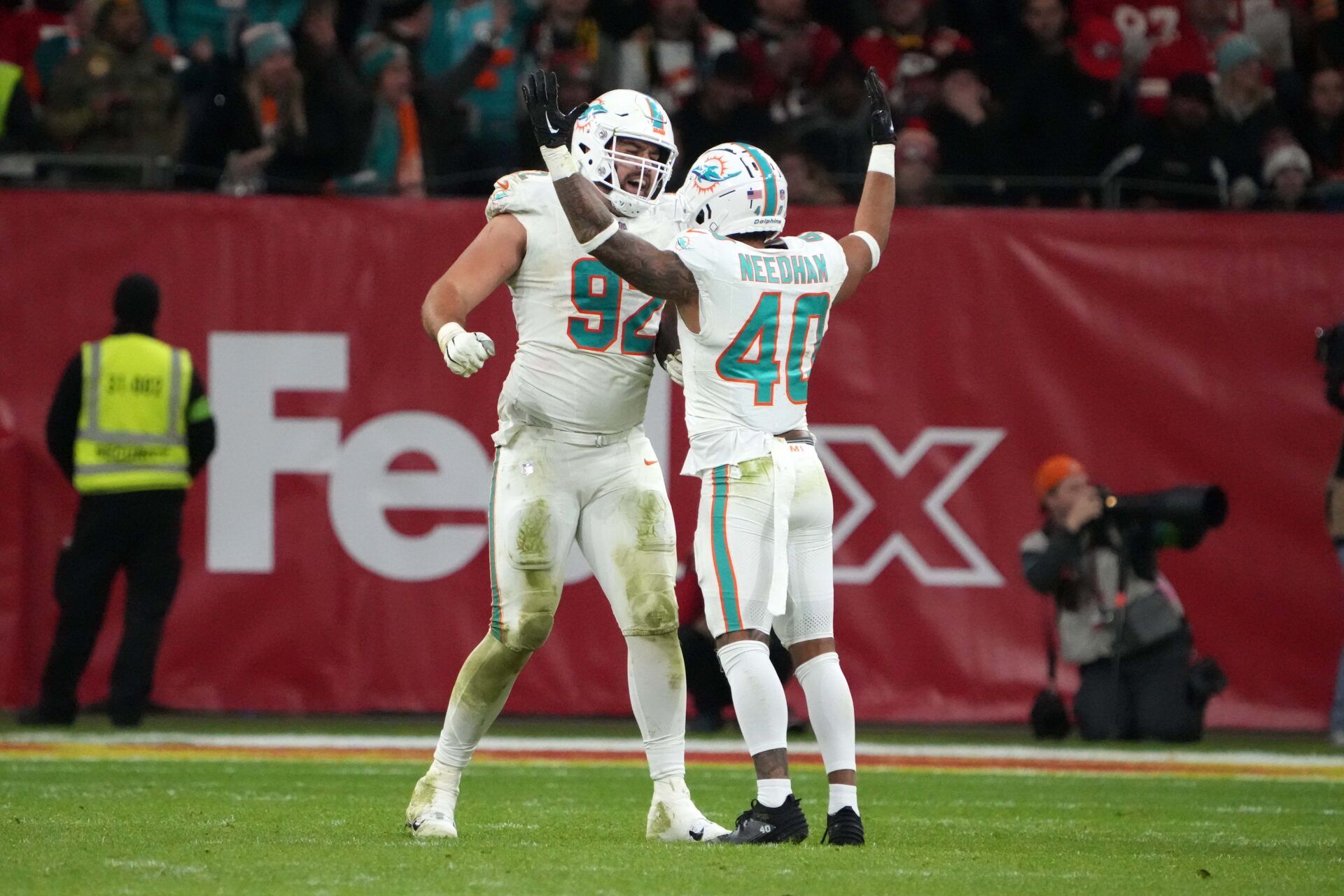 Miami Dolphins defensive tackle Zach Sieler (92)] and cornerback Nik Needham (40) celebrate after a Kansas City Chiefs fumble in the second half during an NFL International Series game at Deutsche Bank Park.