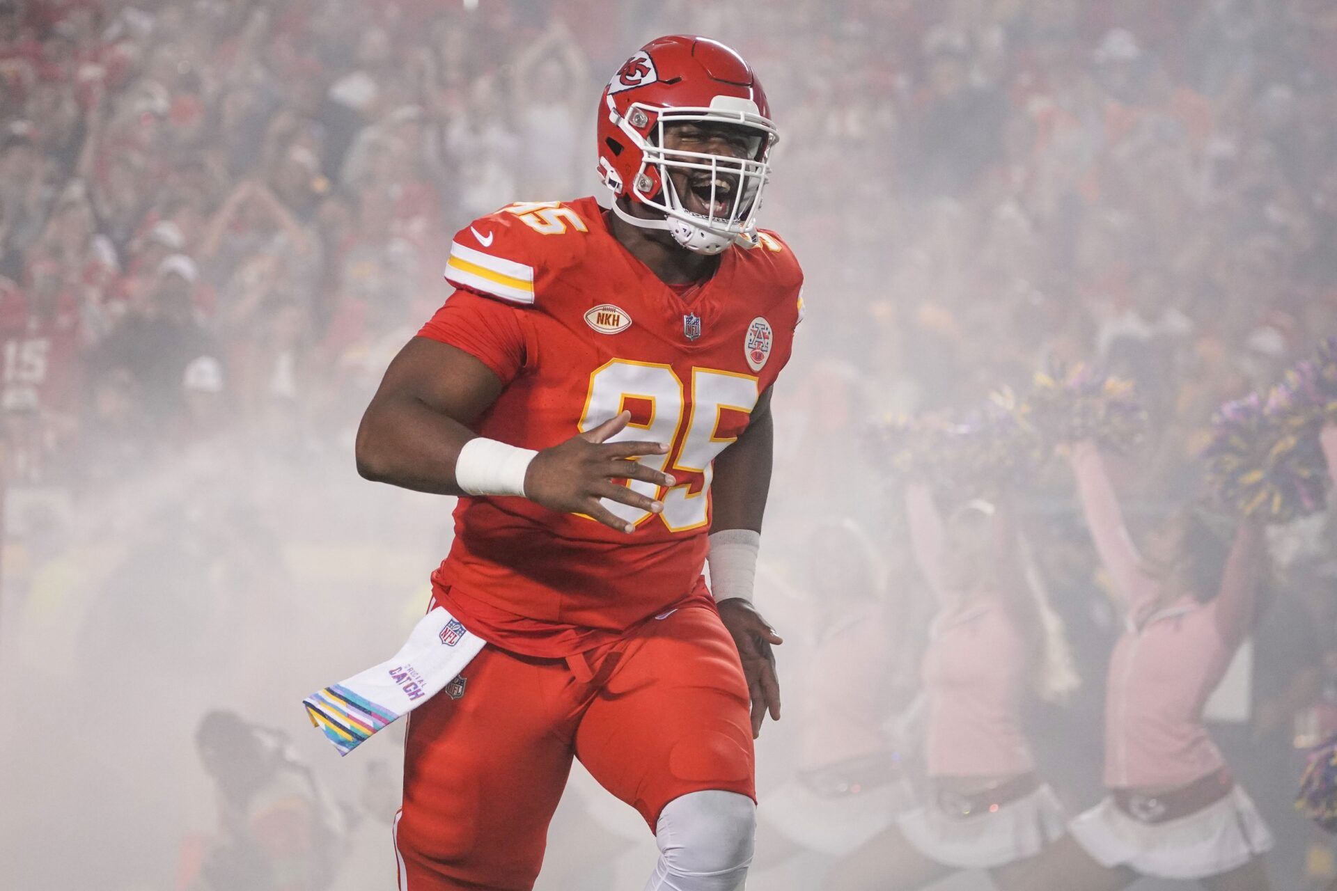 Kansas City Chiefs defensive tackle Chris Jones (95) runs on field against the Denver Broncos prior to a game at GEHA Field at Arrowhead Stadium.