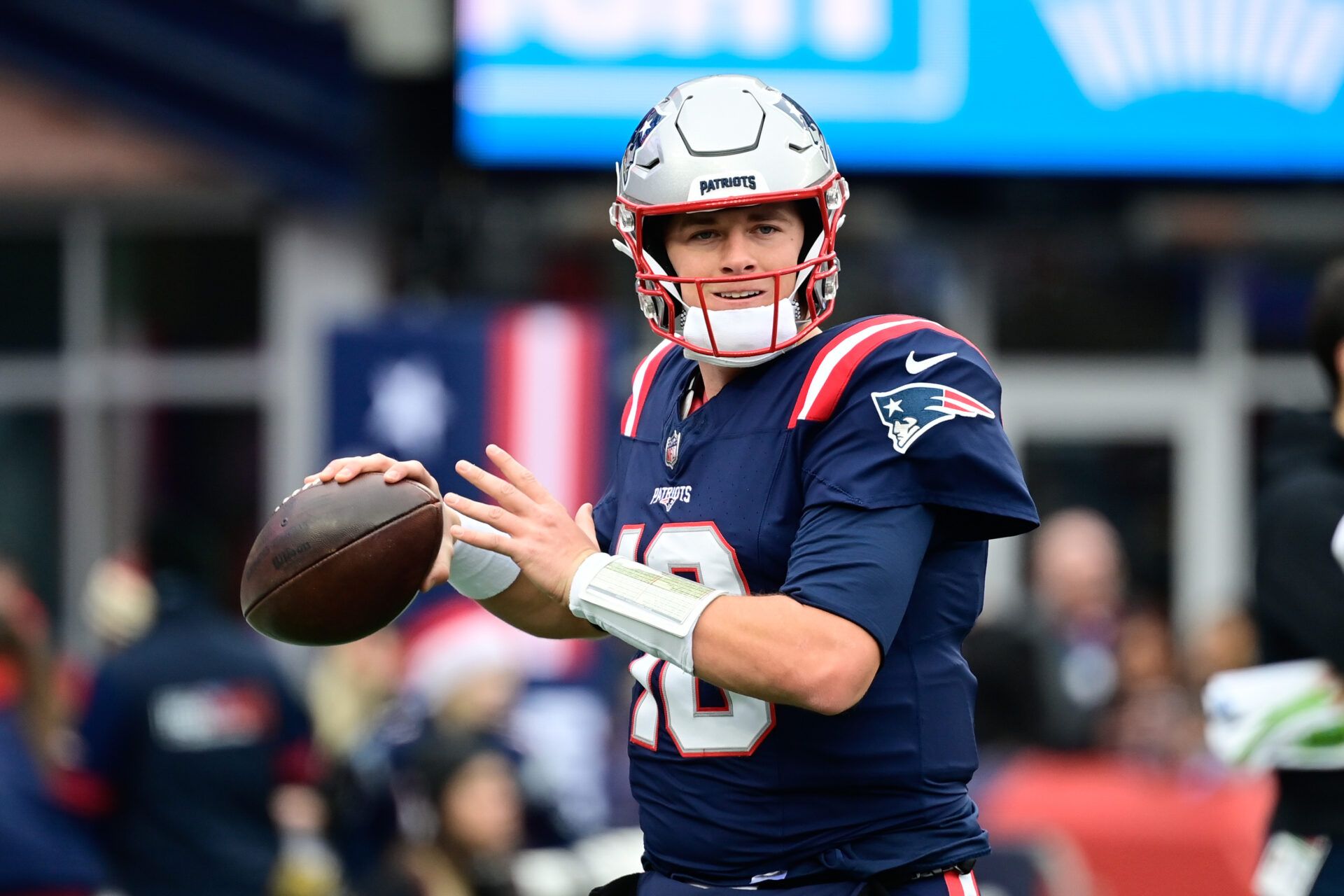 New England Patriots quarterback Mac Jones (10) warms up before a game against the Kansas City Chiefs at Gillette Stadium.