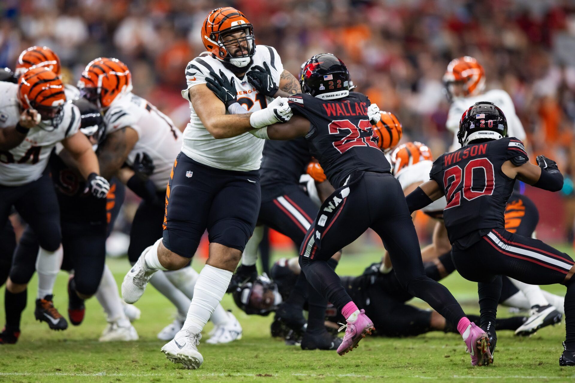 Cincinnati Bengals offensive tackle Cody Ford (61) against Arizona Cardinals safety K'Von Wallace (22) at State Farm Stadium.