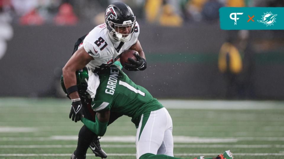 Atlanta Falcons tight end Jonnu Smith (81) is tackled by New York Jets cornerback Sauce Gardner (1) during the first half at MetLife Stadium.