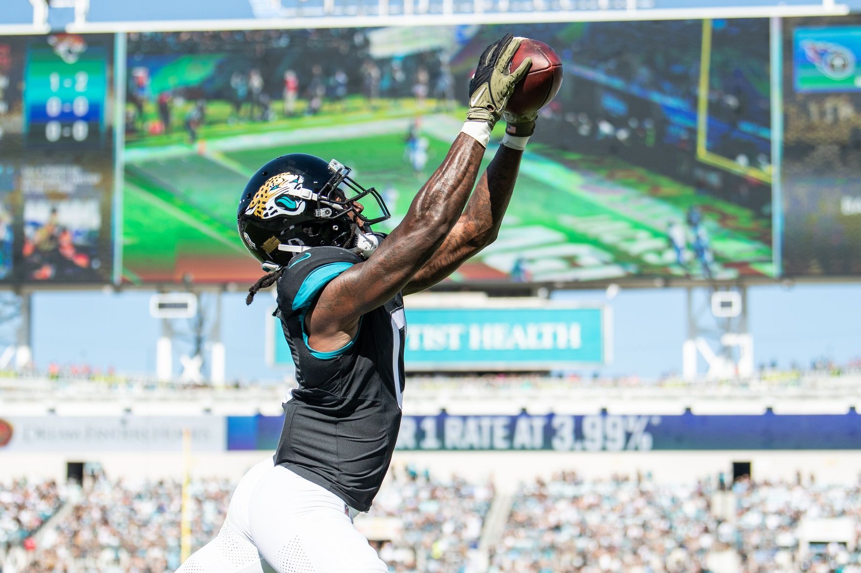 Nov 19, 2023; Jacksonville, Florida, USA; Jacksonville Jaguars wide receiver Calvin Ridley (0) makes the catch for a touchdown against the Tennessee Titans in the first quarter at EverBank Stadium. Mandatory Credit: Jeremy Reper-USA TODAY Sports