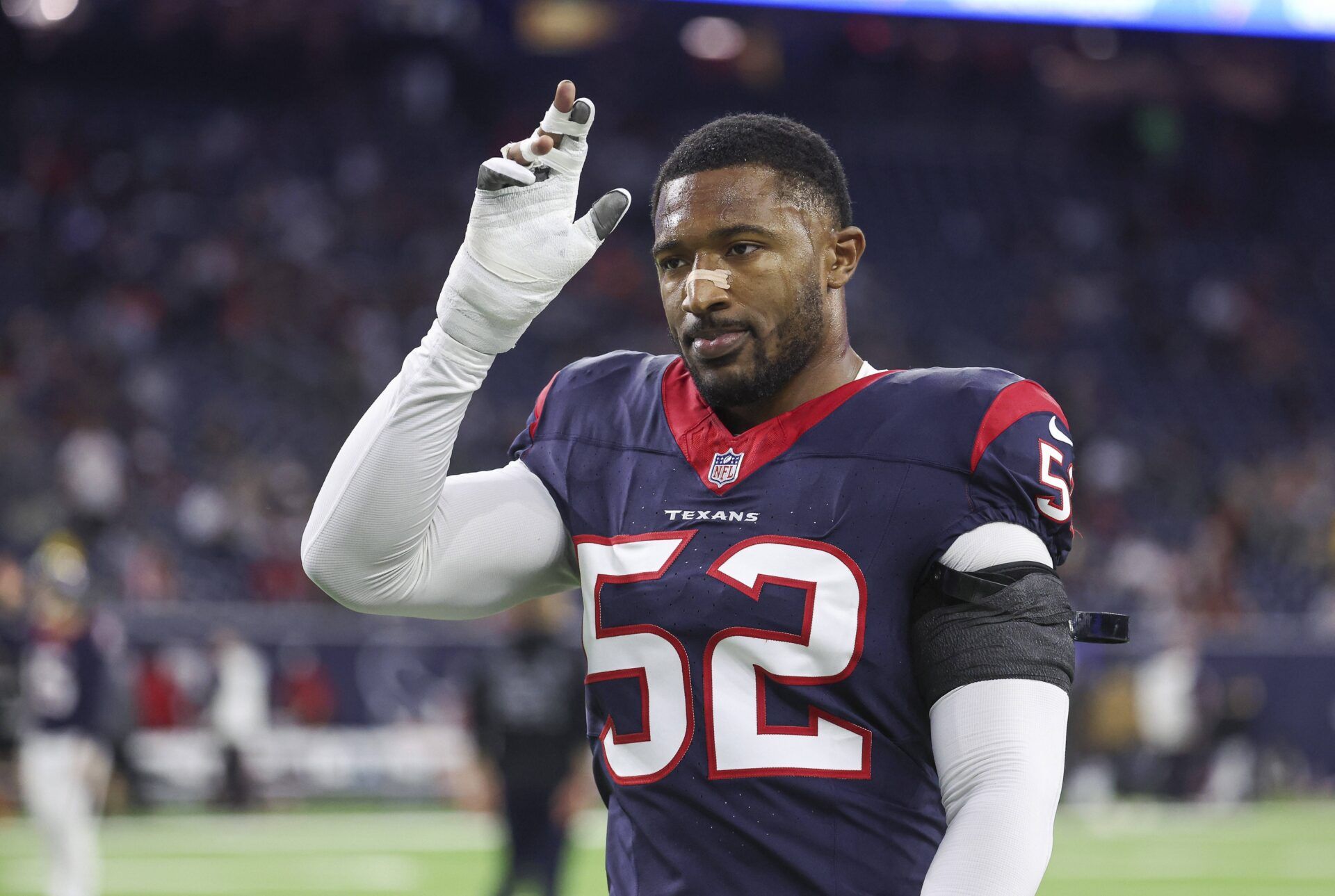 Houston Texans DE Jonathan Greenard walks off the field.