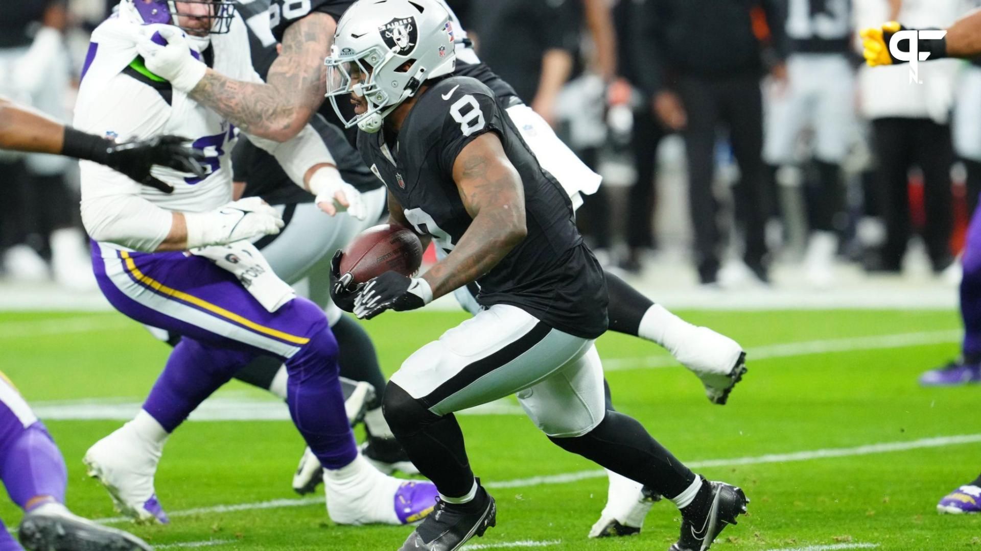 Las Vegas Raiders running back Josh Jacobs (8) rushes against the Minnesota Vikings during the first quarter at Allegiant Stadium.