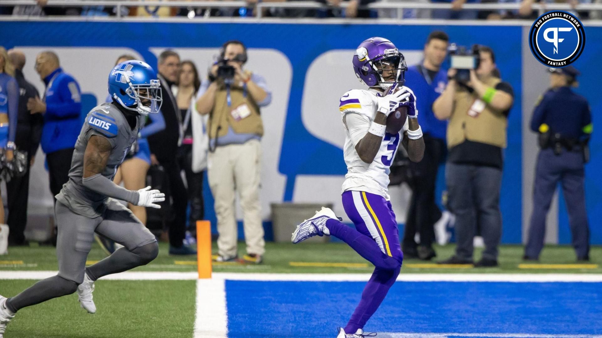 Minnesota Vikings wide receiver Jordan Addison (3) catches a pass for a touchdown in front of Detroit Lions cornerback Cameron Sutton (1) during second half at Ford Field.