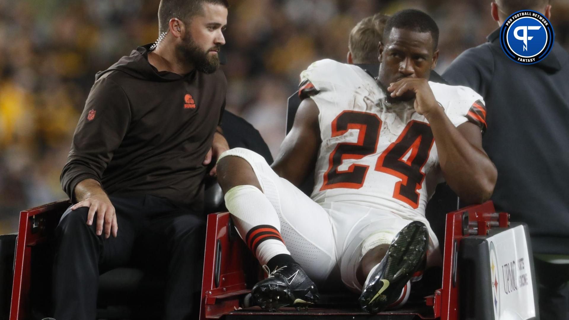 Cleveland Browns running back Nick Chubb (24) is taken from the field on a cart after suffering an apparent injury against the Pittsburgh Steelers during the second quarter at Acrisure Stadium.