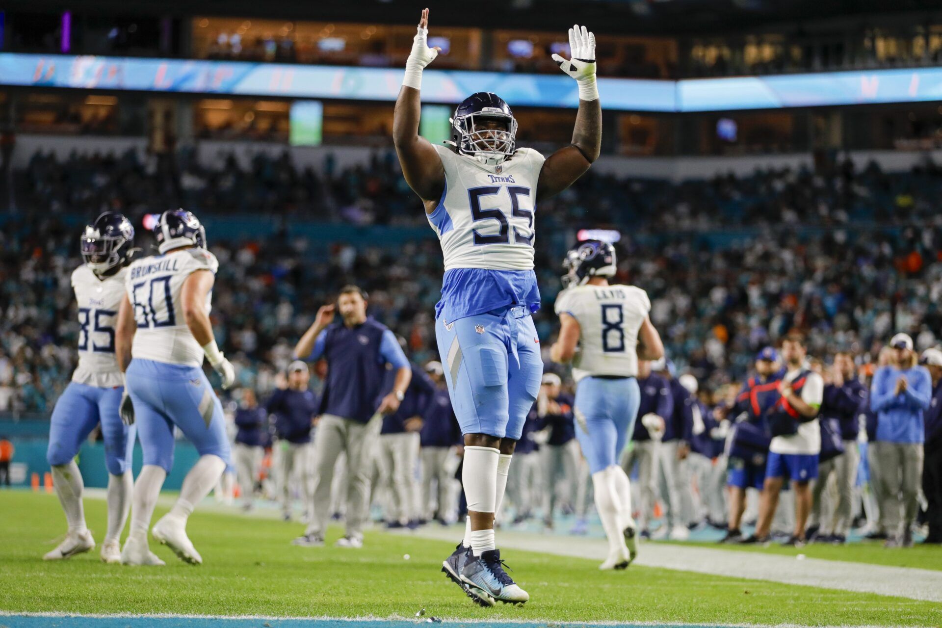 Tennessee Titans guard Aaron Brewer (55) celebrates after a touchdown by running back Derrick Henry (not pictured) during the fourth quarter at Hard Rock Stadium.