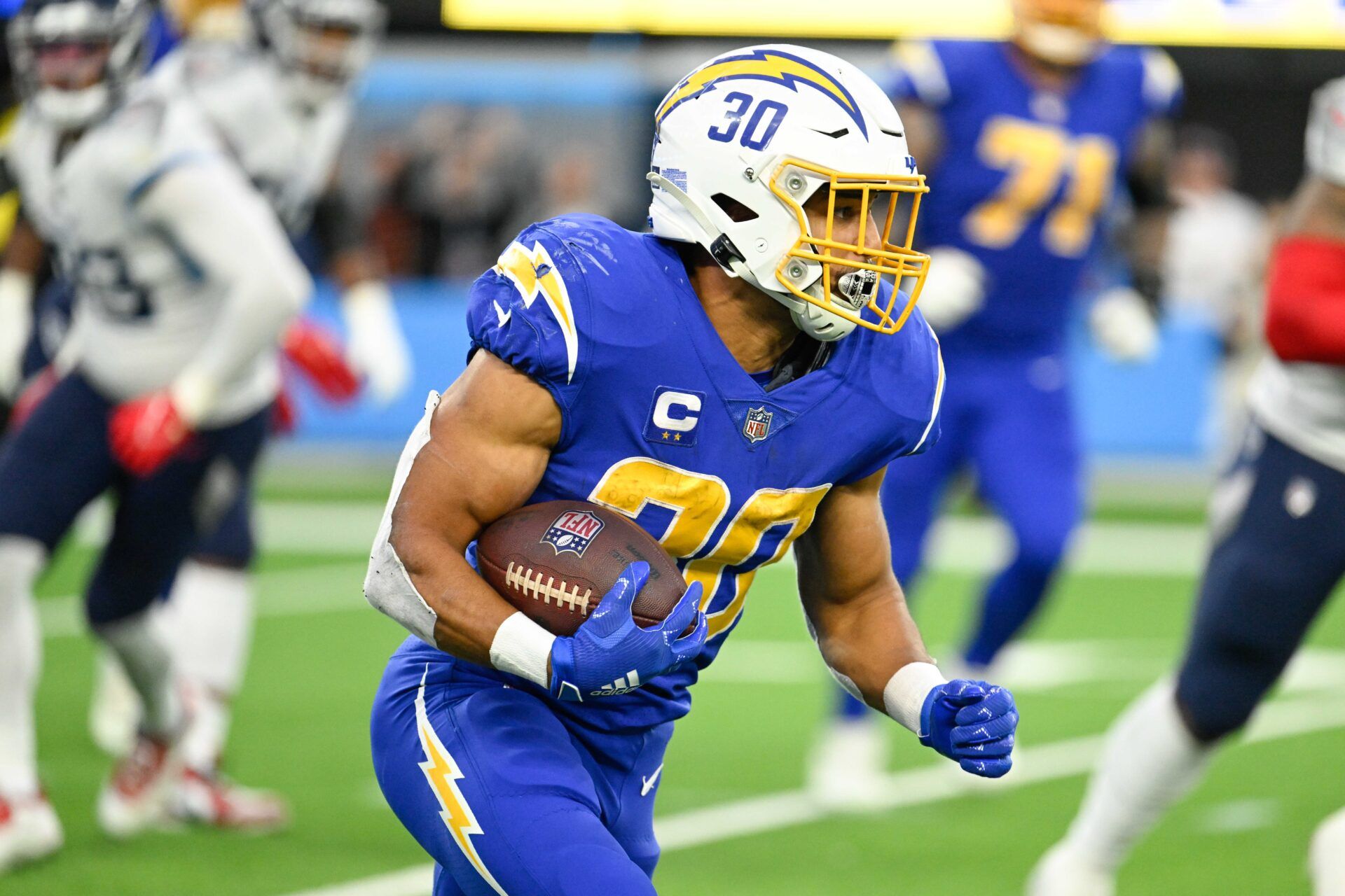 Los Angeles Chargers running back Austin Ekeler (30) carries the ball during the fourth quarter against the Tennessee Titans at SoFi Stadium.