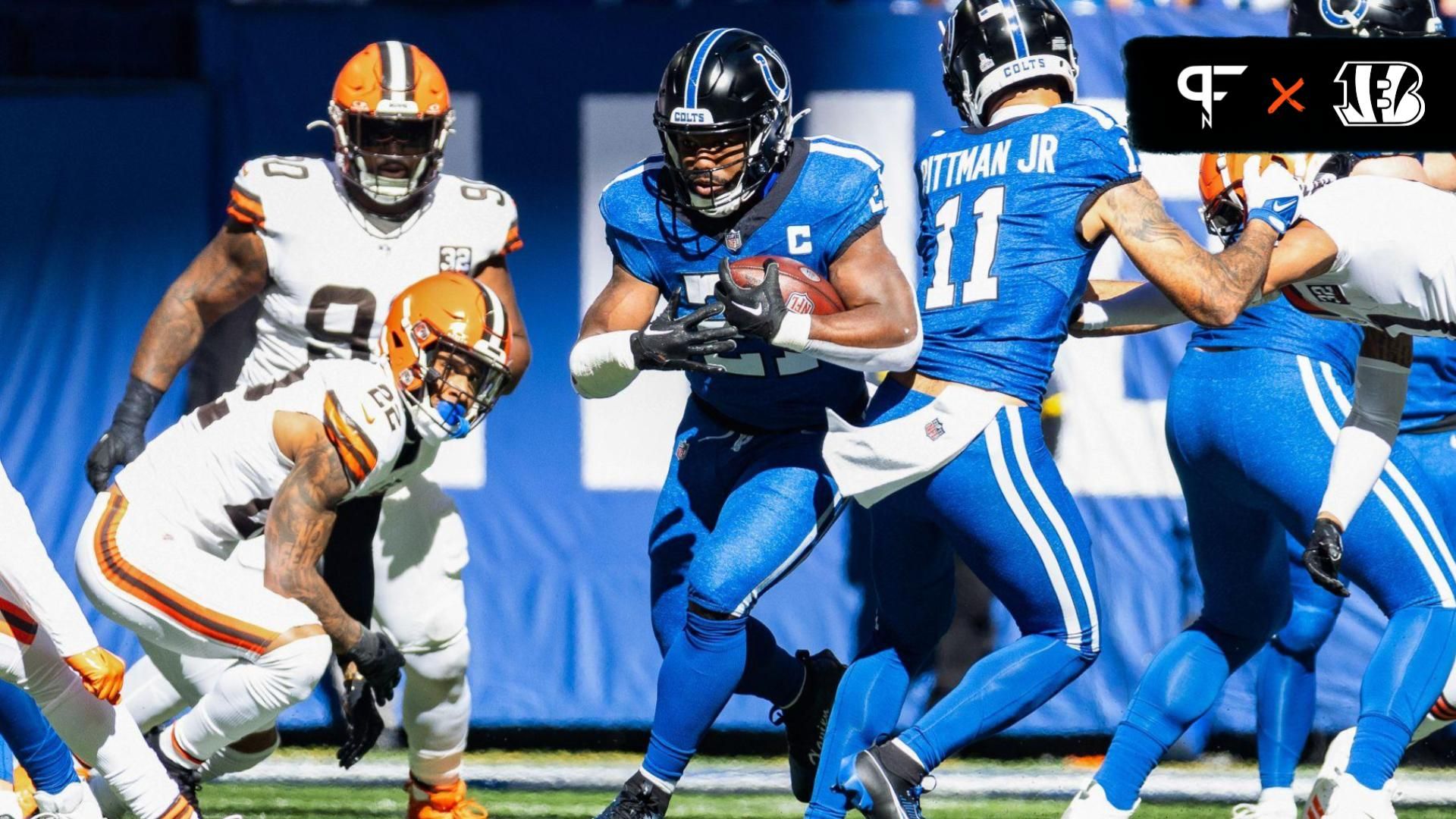 Indianapolis Colts running back Zack Moss (21) runs the ball while Cleveland Browns safety Grant Delpit (22) defends in the second quarter at Lucas Oil Stadium.