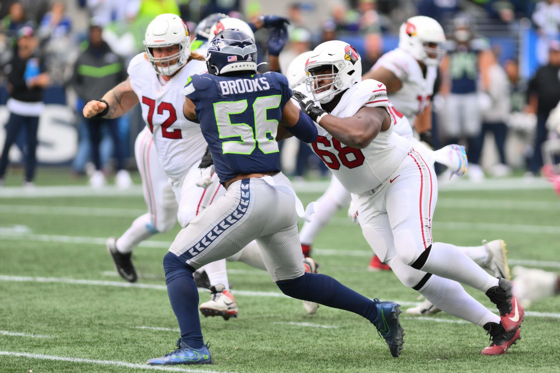 Arizona Cardinals offensive tackle Kelvin Beachum (68) blocks Seattle Seahawks linebacker Jordyn Brooks (56) during the game at Lumen Field.