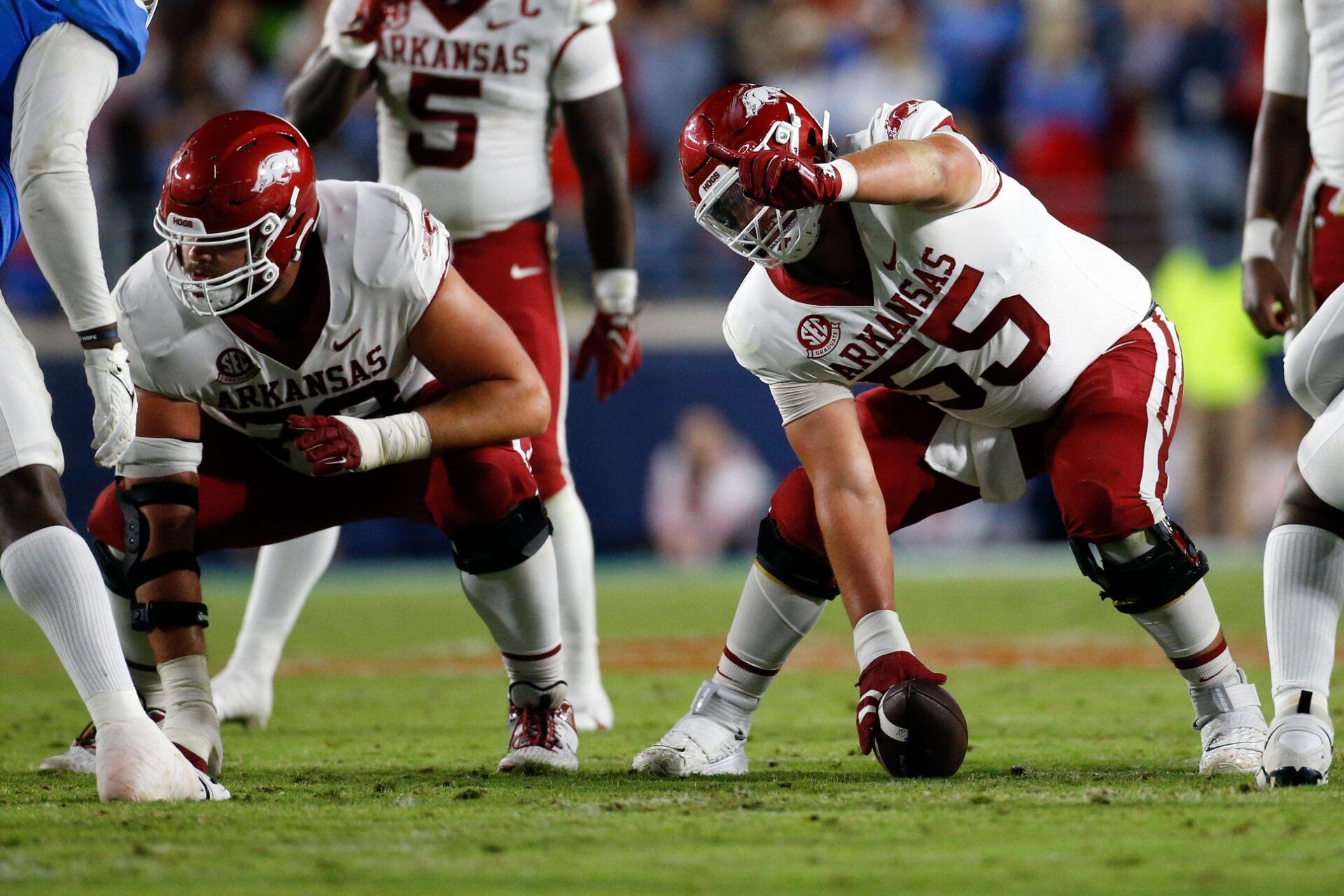 Arkansas Razorbacks offensive linemen Beaux Limmer (55) gives direction prior to the snap during the second half against the Mississippi Rebels at Vaught-Hemingway Stadium.