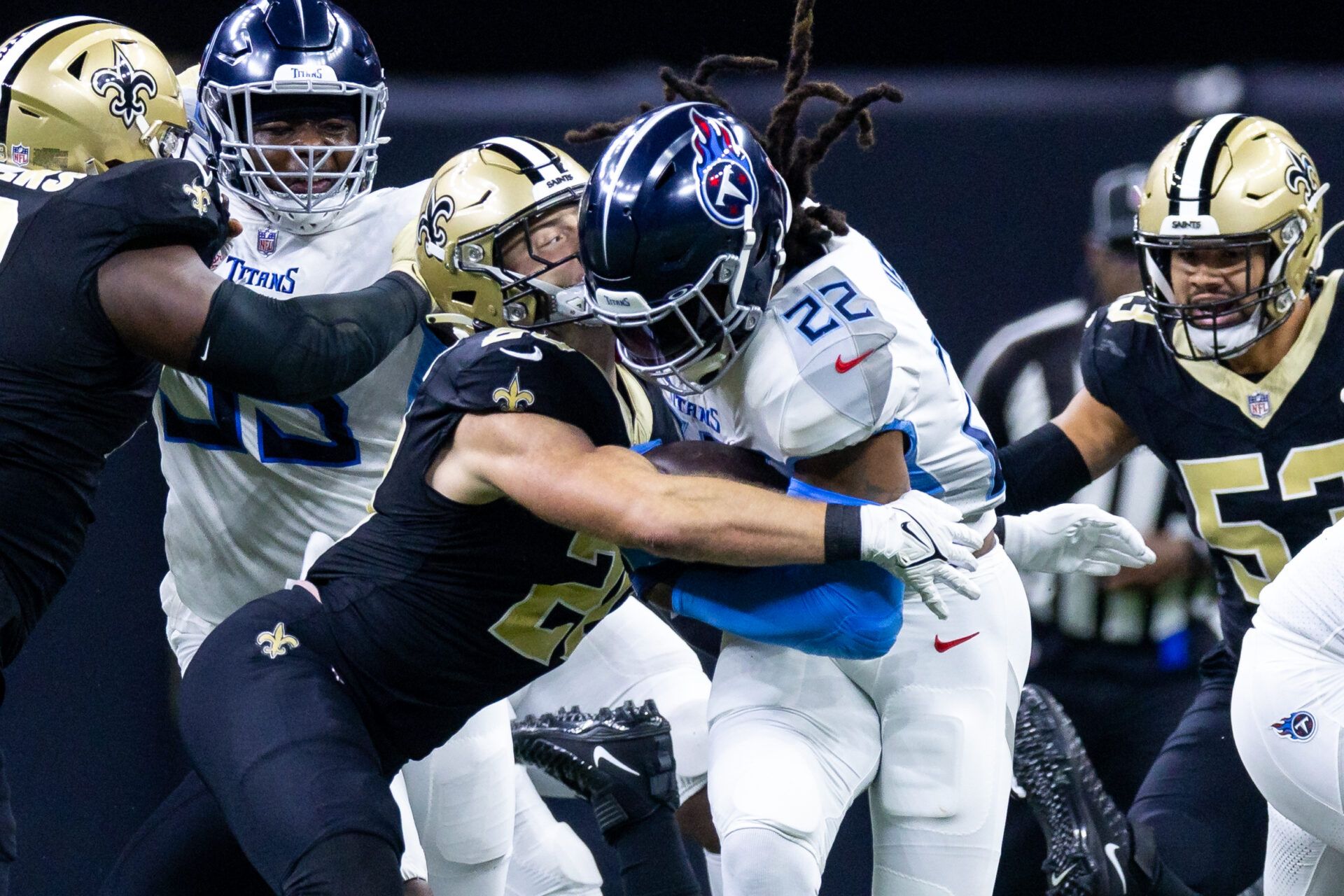 Tennessee Titans running back Derrick Henry (22) is tackled by New Orleans Saints linebacker Pete Werner (20) during the first half at the Caesars Superdome.