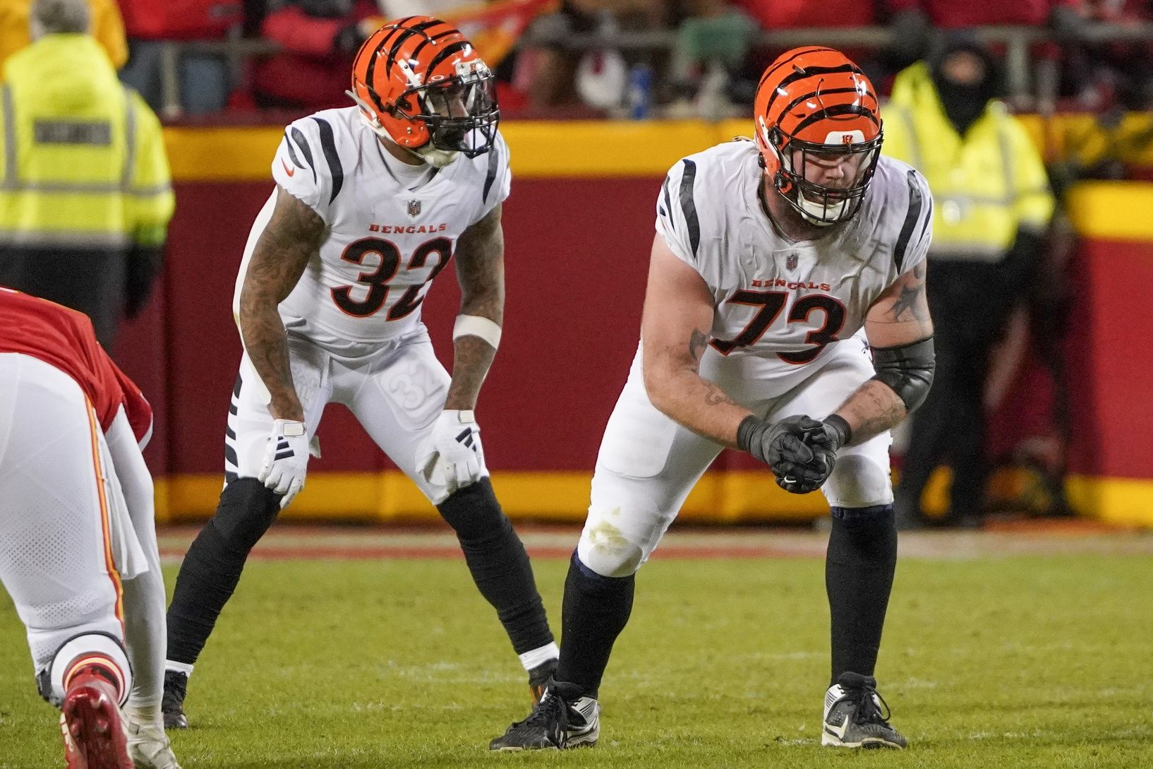 Cincinnati Bengals running back Trayveon Williams (32) and offensive tackle Jonah Williams (73) at the line of scrimmage against the Kansas City Chiefs during the game at GEHA Field at Arrowhead Stadium.