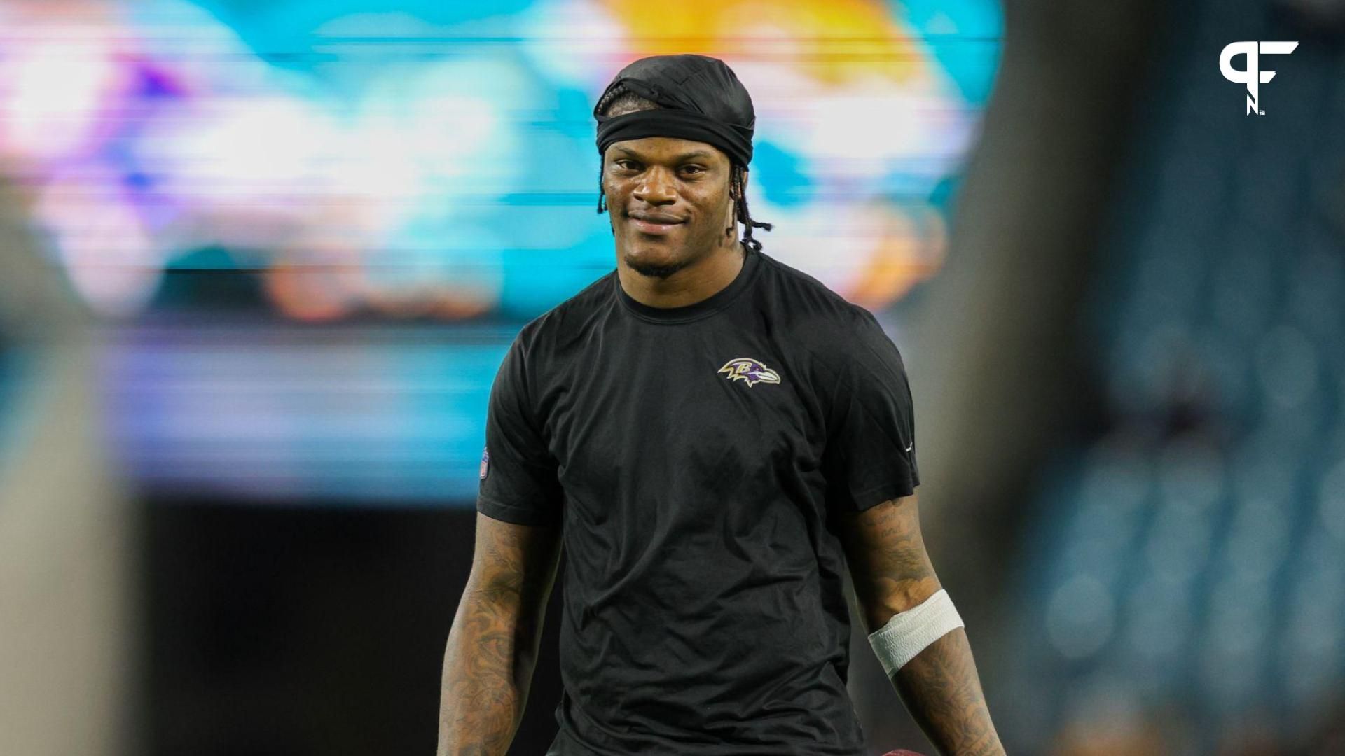 Baltimore Ravens quarterback Lamar Jackson (8) warms up before a game against the Jacksonville Jaguars at EverBank Stadium.