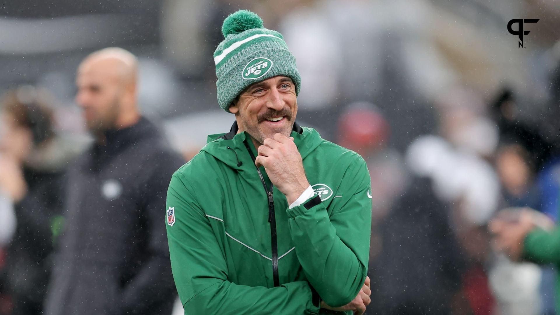 New York Jets quarterback Aaron Rodgers (8) watches warm ups before a game against the Atlanta Falcons at MetLife Stadium.