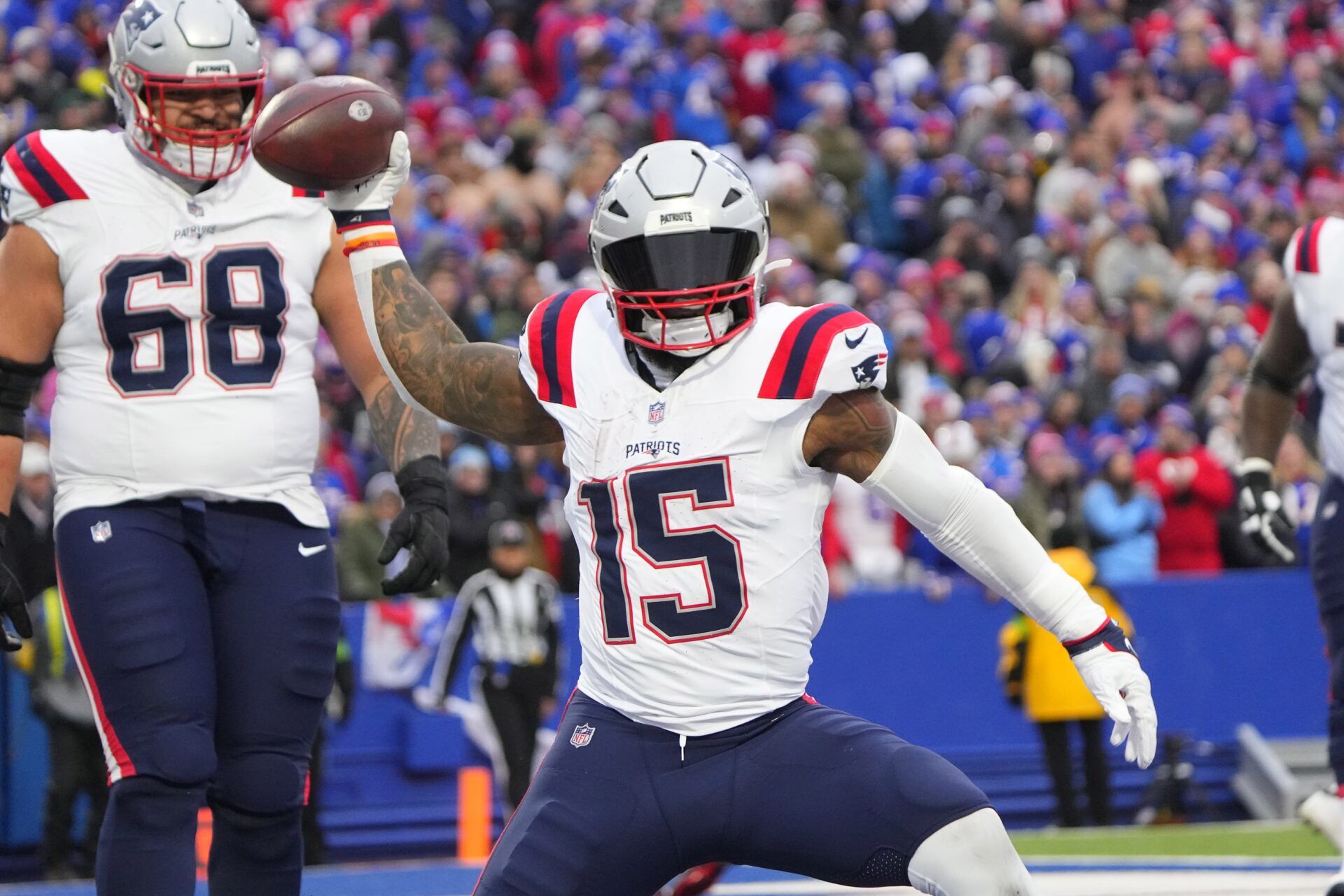 New England Patriots RB Ezekiel Elliott (15) spikes the ball after scoring a touchdown against the Buffalo Bills.