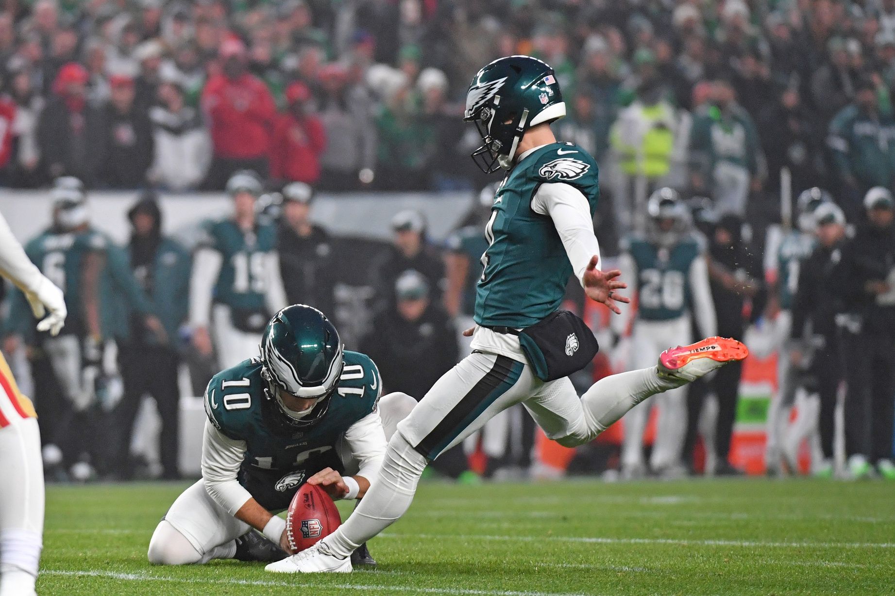 Philadelphia Eagles place kicker Jake Elliott (4) kicks a field goal as punter Braden Mann (10) holds the football against the San Francisco 49ers at Lincoln Financial Field.