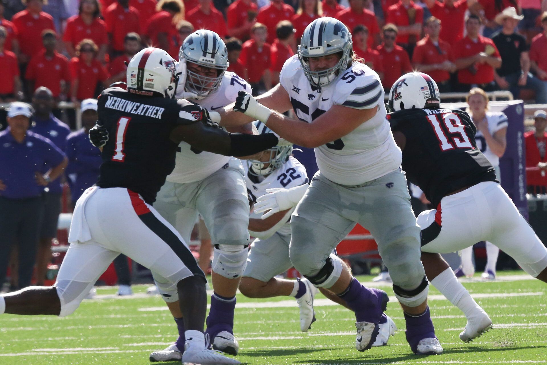 Kansas State Wildcats offensive tackle Cooper Beebe (50) blocks Texas Tech Red Raiders defensive linebacker Krishon Merriweather (1) in the first half at Jones AT&T Stadium.