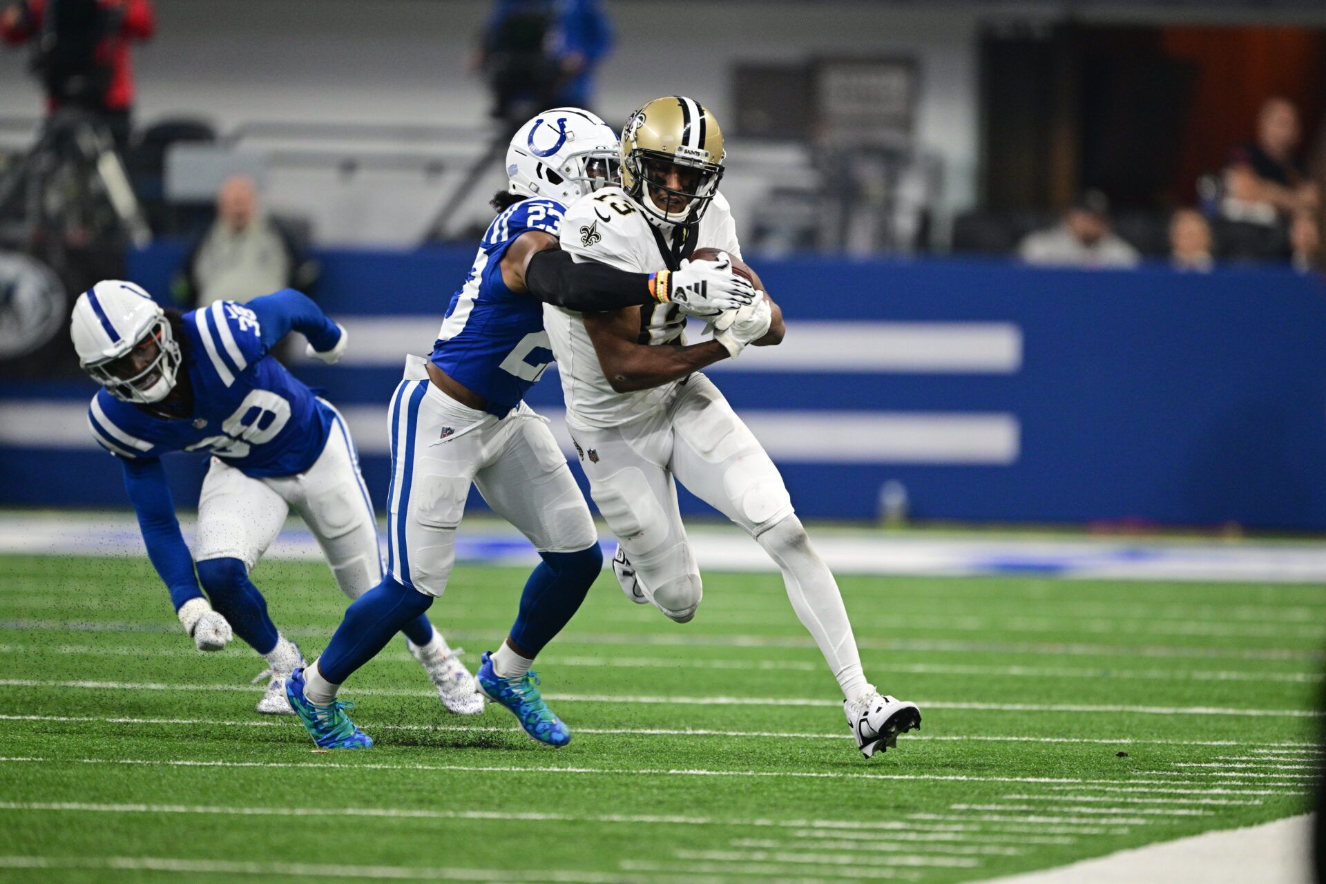 New Orleans Saints wide receiver Michael Thomas (13) is tackled by Indianapolis Colts cornerback Kenny Moore II (23) during the first quarter at Lucas Oil Stadium.