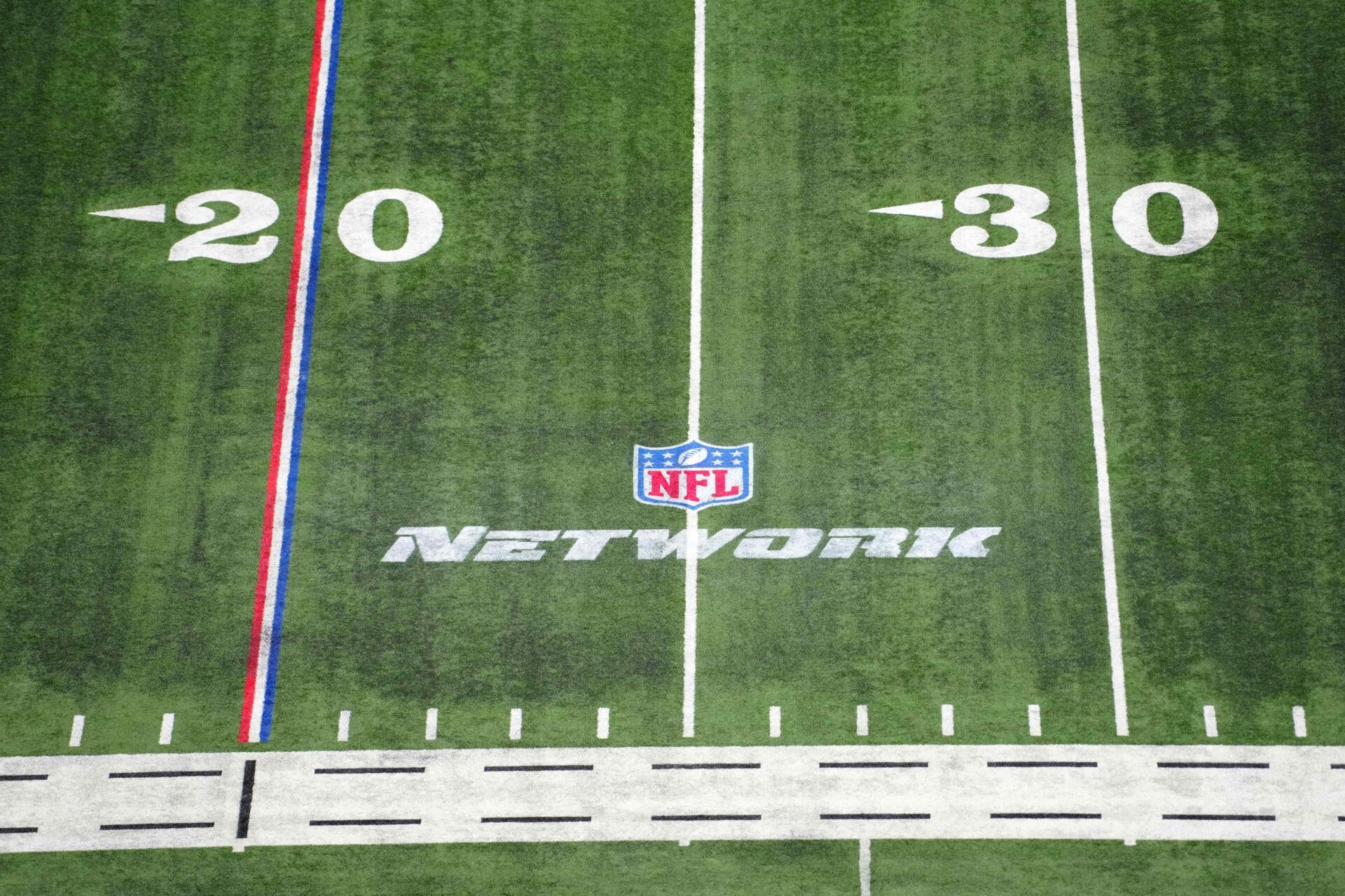 The NFL Network logo on the field at Lucas Oil Stadium.