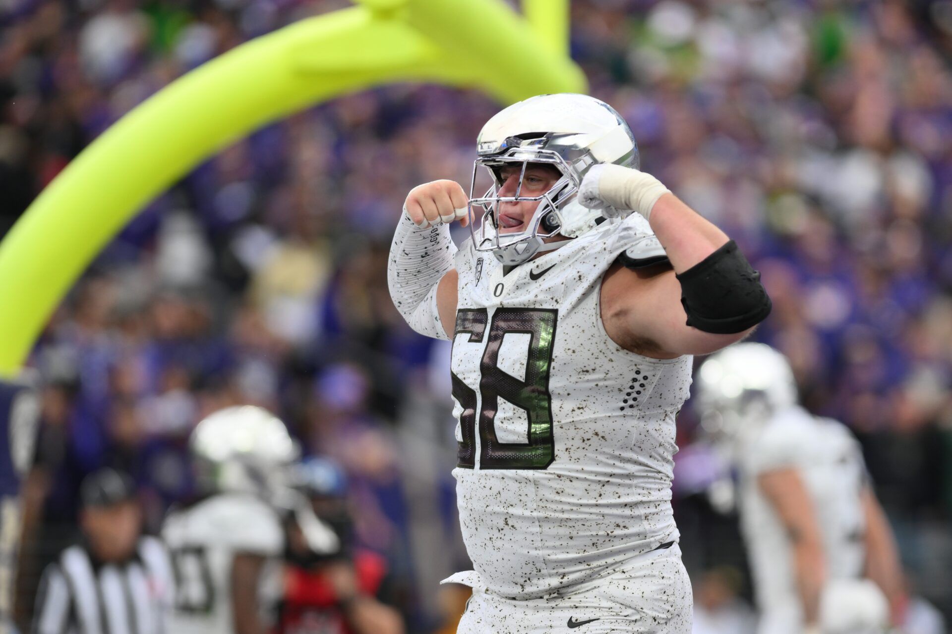 Oregon Ducks offensive lineman Jackson Powers-Johnson (58) celebrates after the Ducks scored a touchdown against the Washington Huskies.