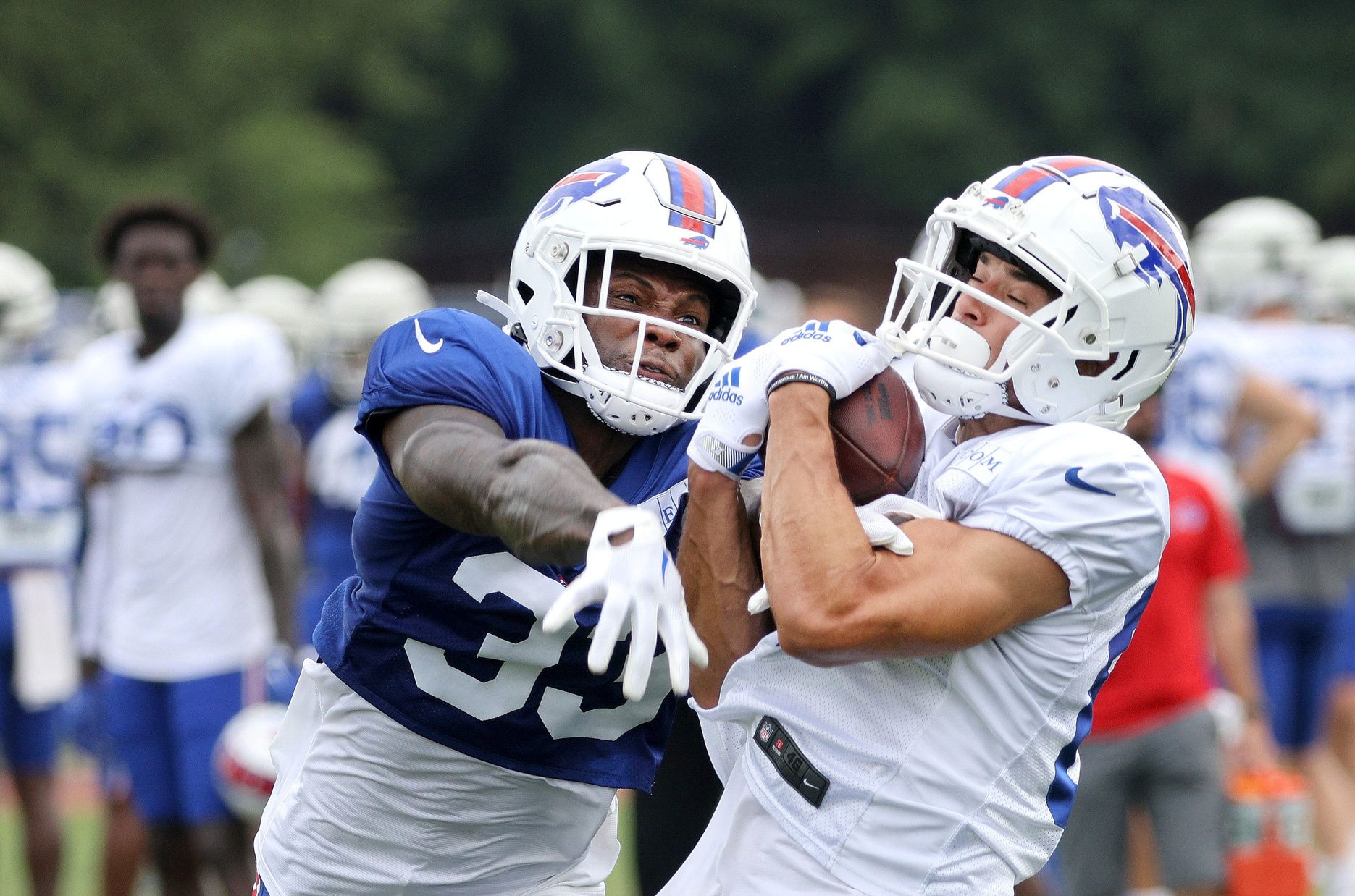 Receiver Andy Isabella catches this deep pass against Siran Neal during training camp.