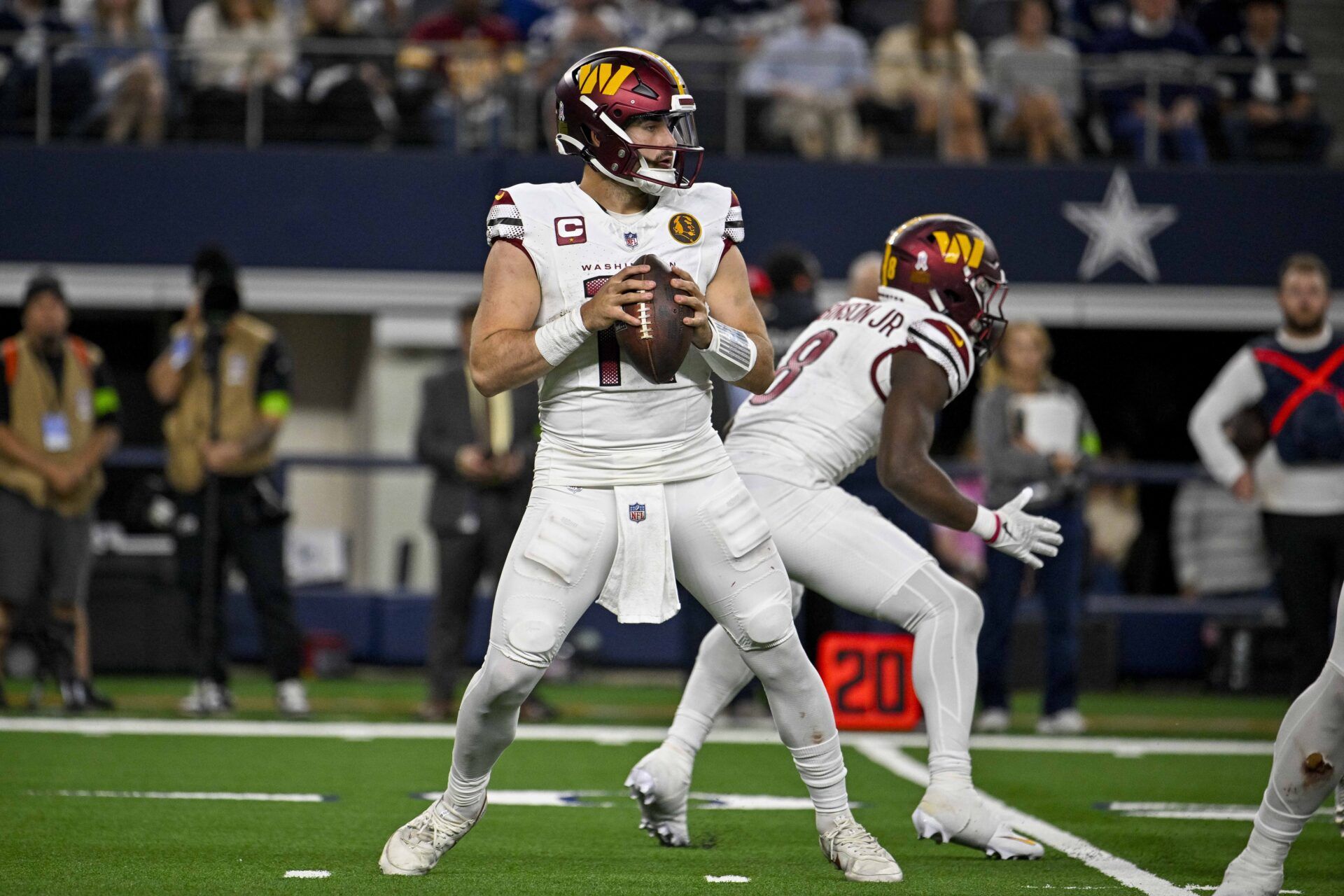 Washington Commanders quarterback Sam Howell (14) in action during the game between the Dallas Cowboys and the Washington Commanders at AT&T Stadium.