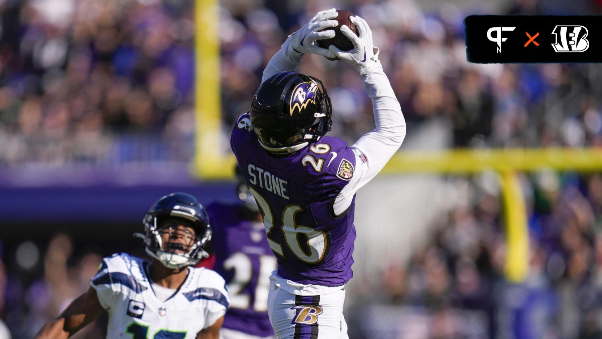 Baltimore Ravens safety Geno Stone (26) catches an interception against the Seattle Seahawks during the first half at M&T Bank Stadium.