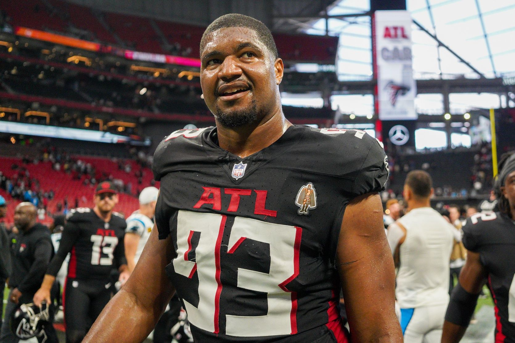 Atlanta Falcons defensive tackle Calais Campbell (93) celebrates after a victory against the Carolina Panthers at Mercedes-Benz Stadium.