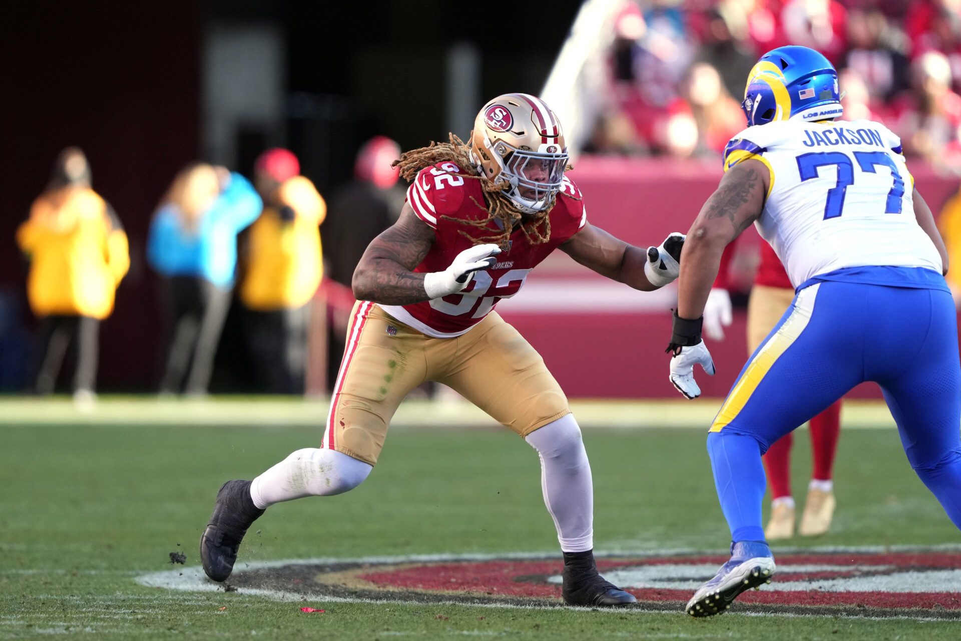 San Francisco 49ers defensive end Chase Young (92) rushes against Los Angeles Rams offensive tackle Alaric Jackson (77) during the third quarter at Levi's Stadium.