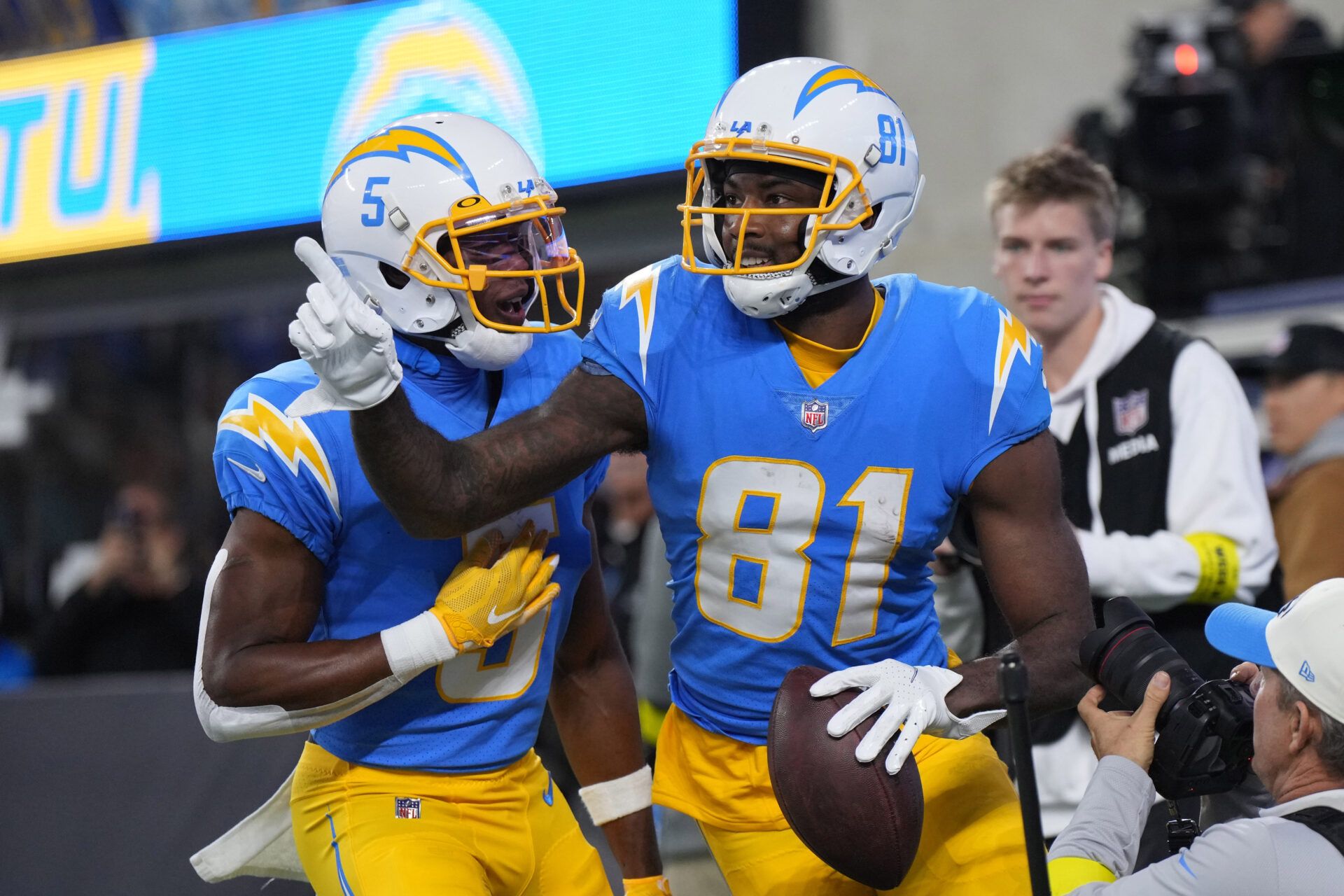 Los Angeles Chargers wide receiver Mike Williams (81) celebrates with wide receiver Joshua Palmer (5) after catching a 10-yard touchdown pass in the first half against the Miami Dolphins at SoFi Stadium.