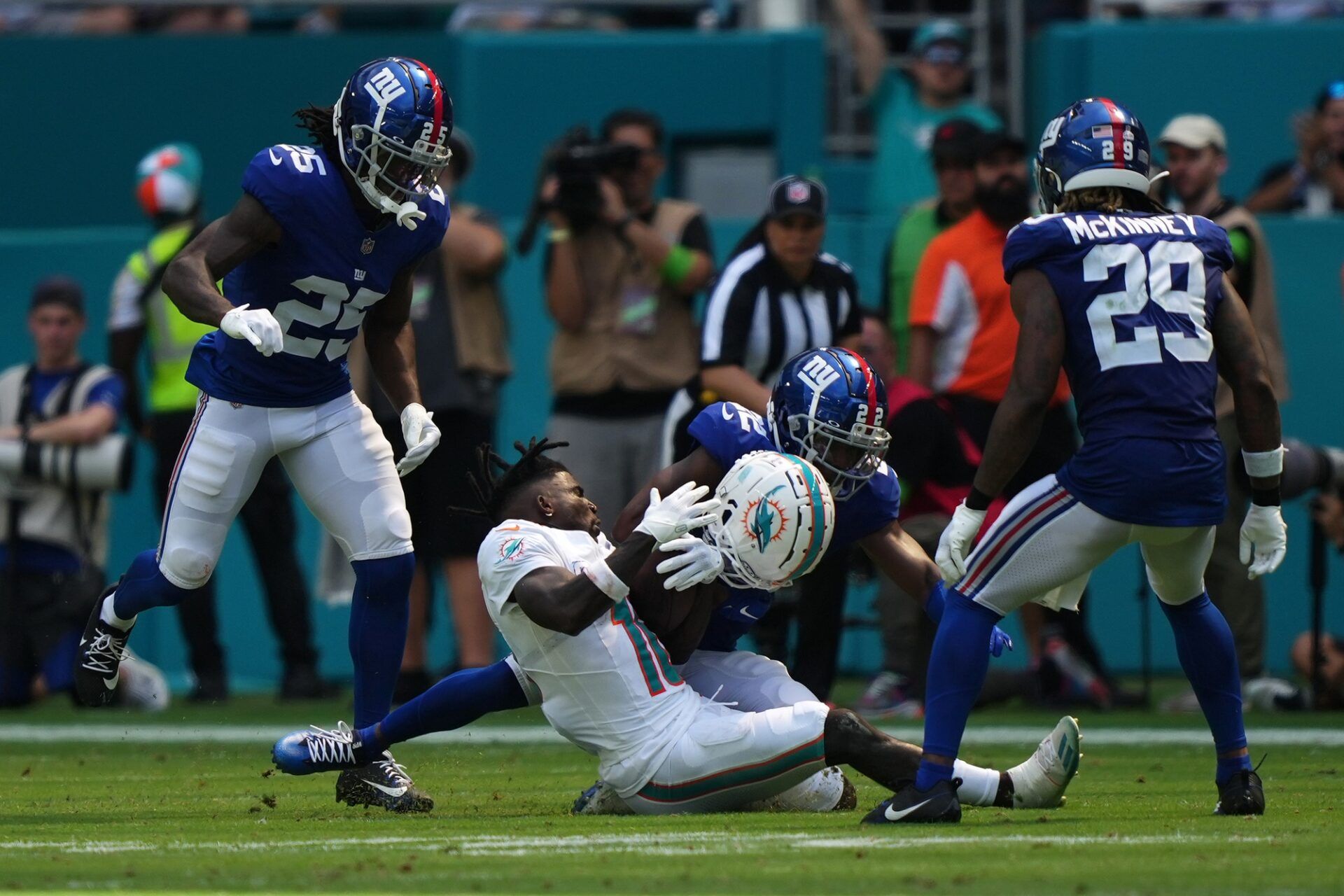 New York Giants cornerback Adoree' Jackson (22) tackles Miami Dolphins wide receiver Tyreek Hill (10) during the first half at Hard Rock Stadium.