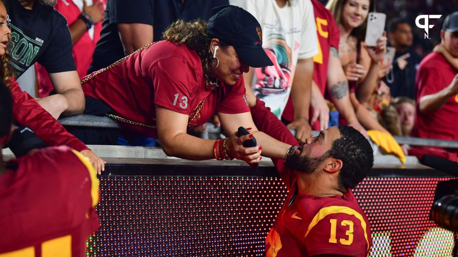 Southern California Trojans quarterback Caleb Williams (13) meets with his mother Dayna Price following the victory against the Arizona Wildcats at Los Angeles Memorial Coliseum.