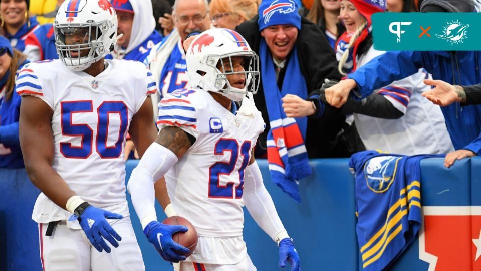 Buffalo Bills free safety Jordan Poyer (21) reacts to his interception return with teammate defensive end Greg Rousseau (50) against the Miami Dolphins during the second half at Highmark Stadium.