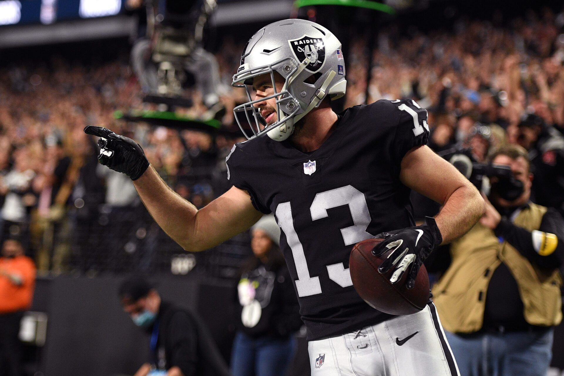 Las Vegas Raiders wide receiver Hunter Renfrow (13) celebrates after scoring a touchdown against the Los Angeles Chargers during the first quarter at Allegiant Stadium.